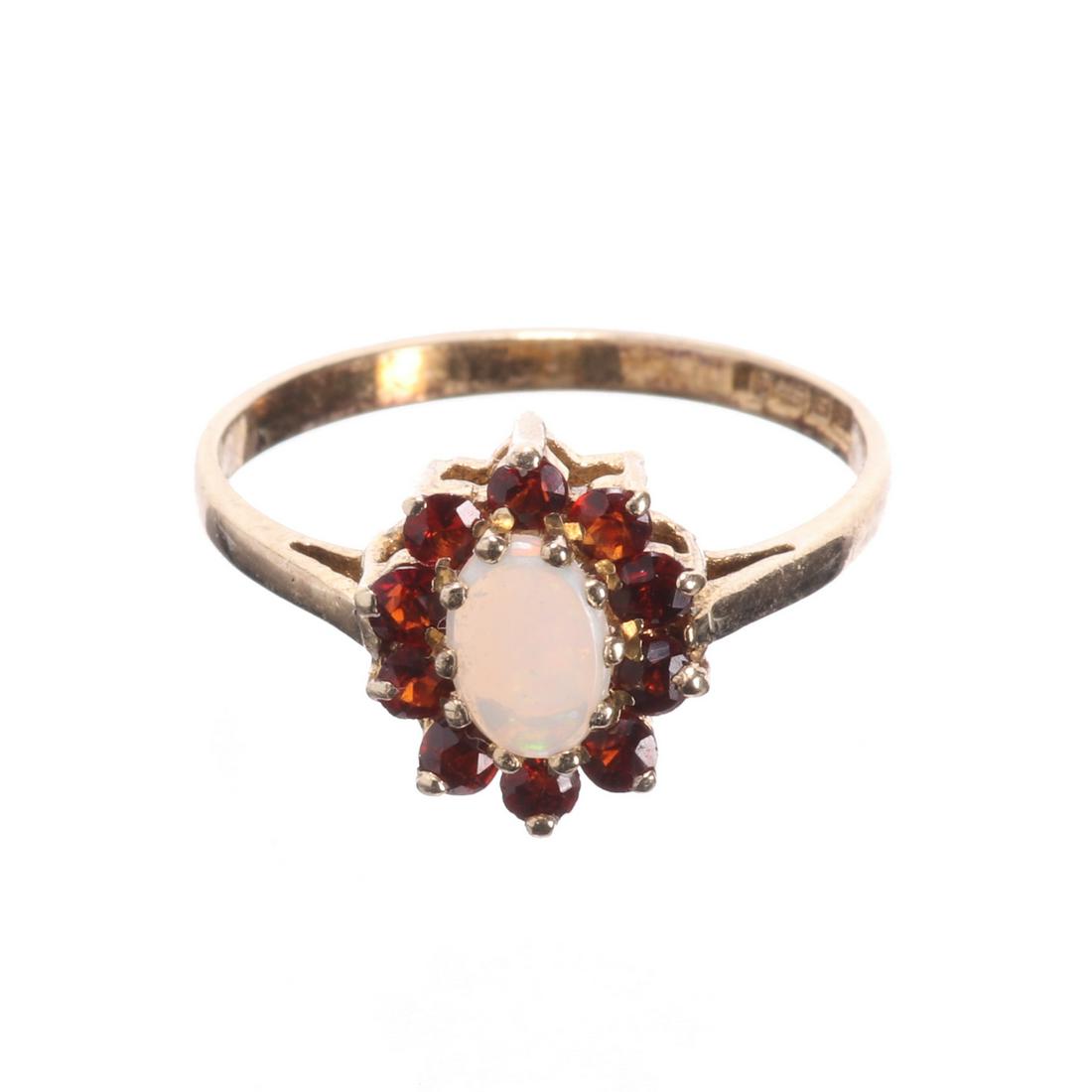 Opal & Garnet Ring: Please study all photographs carefully to get an accurate representation of the item. Please message us for information on dimensions/condition report. We offer in-house shipping internationally (US a