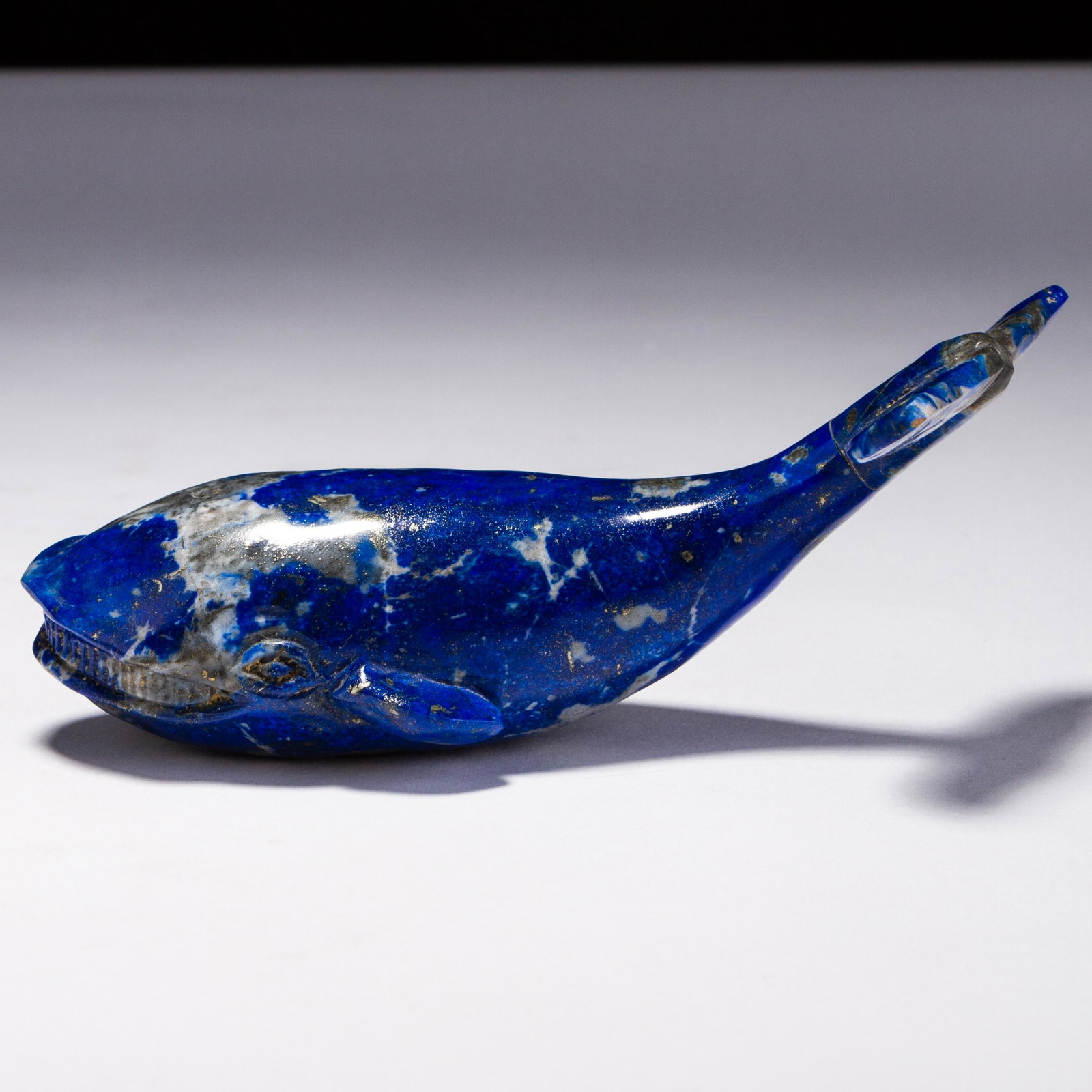 Inuit Lapis Lazuli Sculpture of Whale: MEASURING APPROX 13 X 5.5CM HIGH. Please follow us on Instagram to stay updated with our current and future auctions: @albinus_auctions. Study all photographs carefully to get an accurate representati