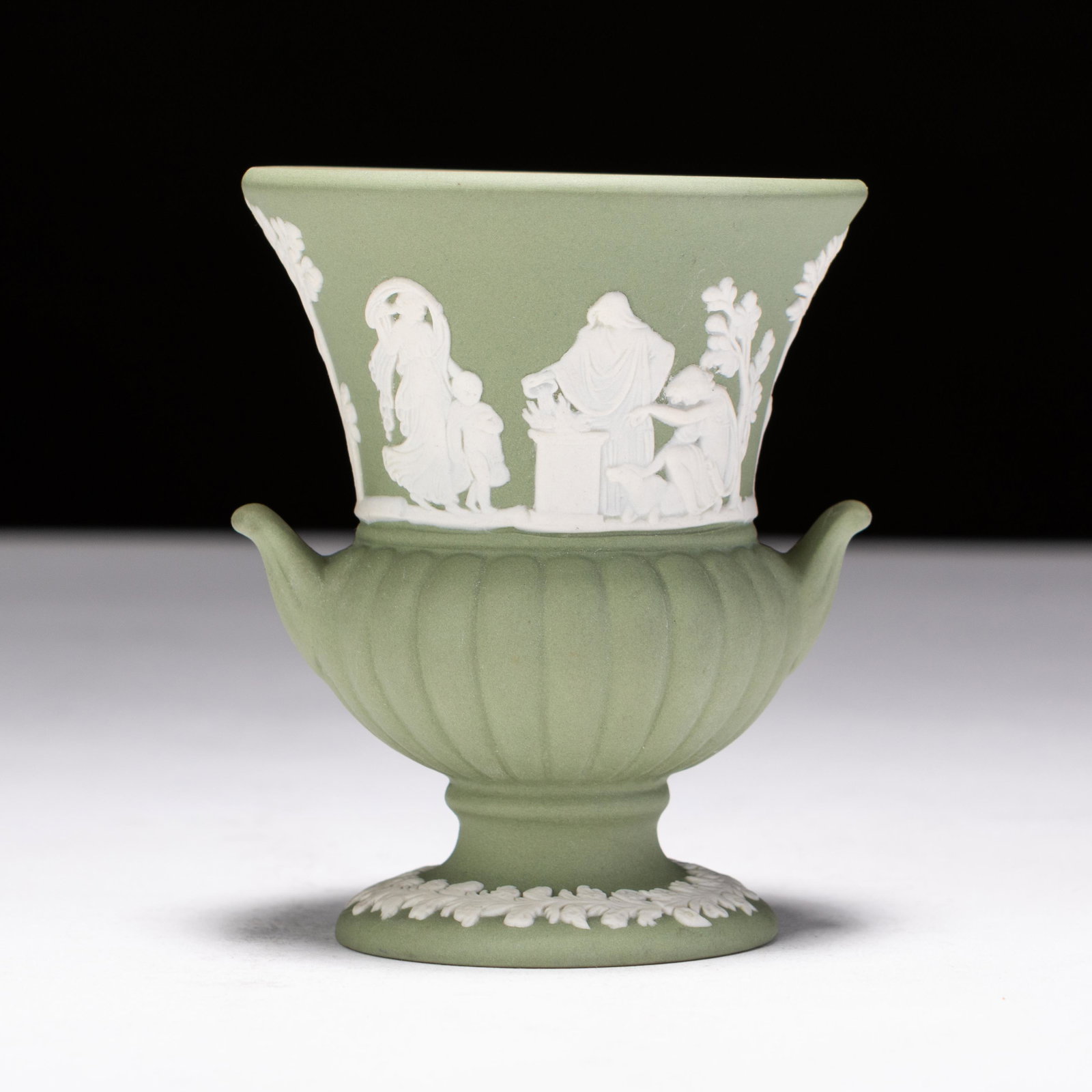 Wedgwood Green Jasperware Neoclassical Vase: MEASURES APPROX 7.5 X 8.5CM HIGH. Please follow us on Instagram to stay updated with our current and future auctions: @albinus_auctions. Study all photographs carefully to get an accurate representati