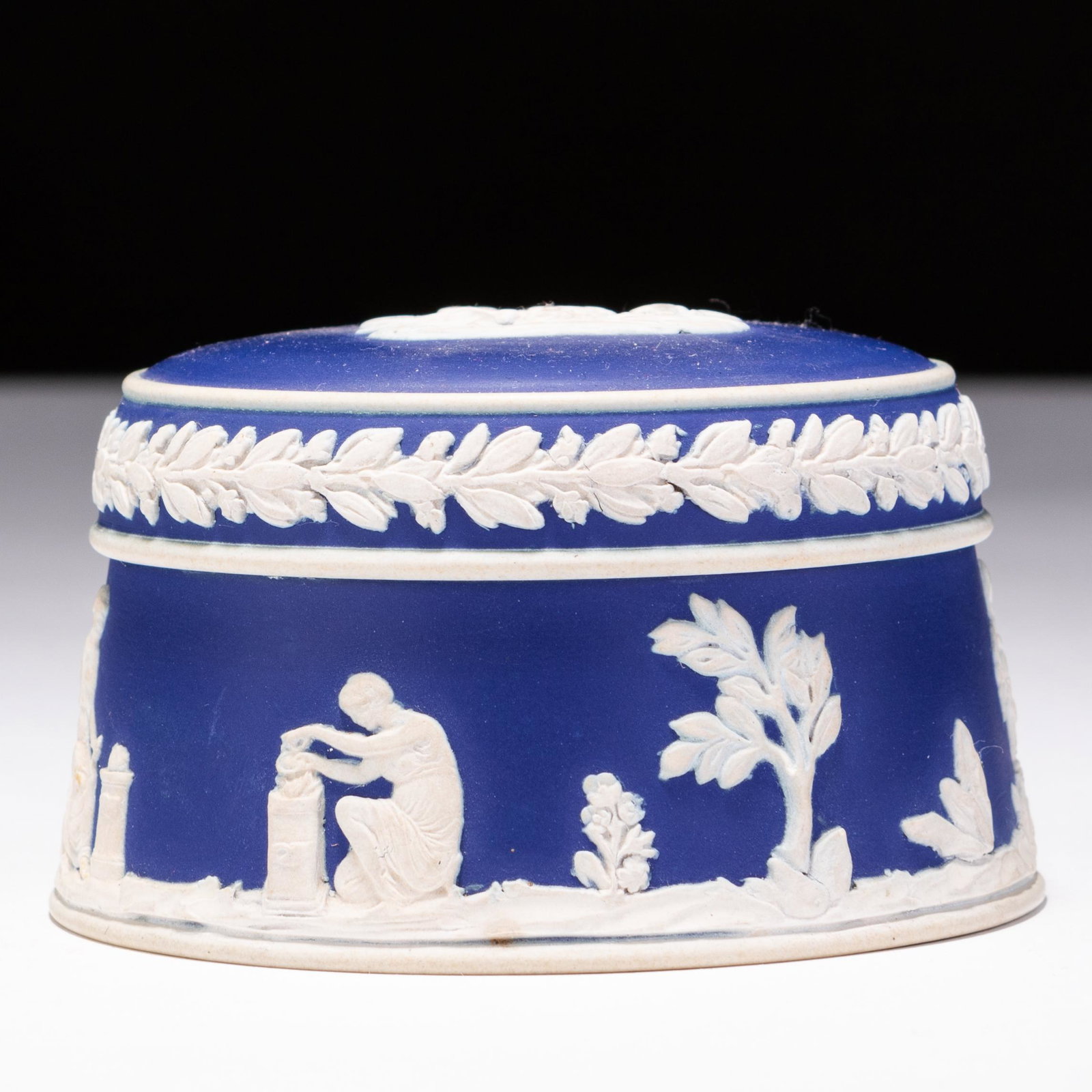 Wedgwood Dark Blue Jasperware Neoclassical Lidded Trinket Box: MEASURES APPROX 9 X 5.5CM. Please follow us on Instagram to stay updated with our current and future auctions: @albinus_auctions. Study all photographs carefully to get an accurate representation of t