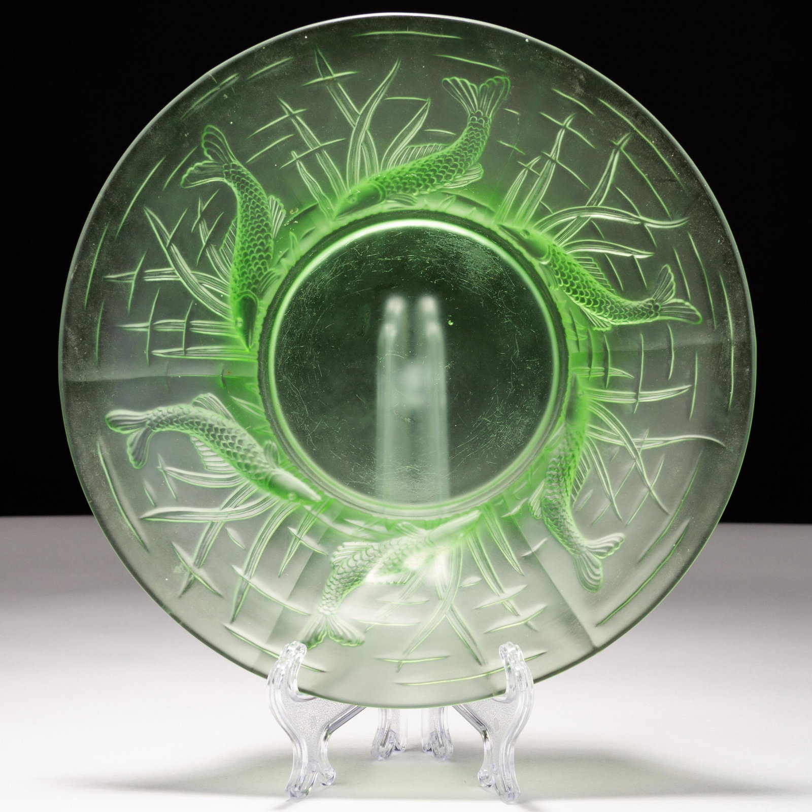 Art Deco Intaglio Uranium Glass Fish Plate: MEASURES APPROX 21 X 5CM. Please follow us on Instagram to stay updated with our current and future auctions: @albinus_auctions. Study all photographs carefully to get an accurate representation of th