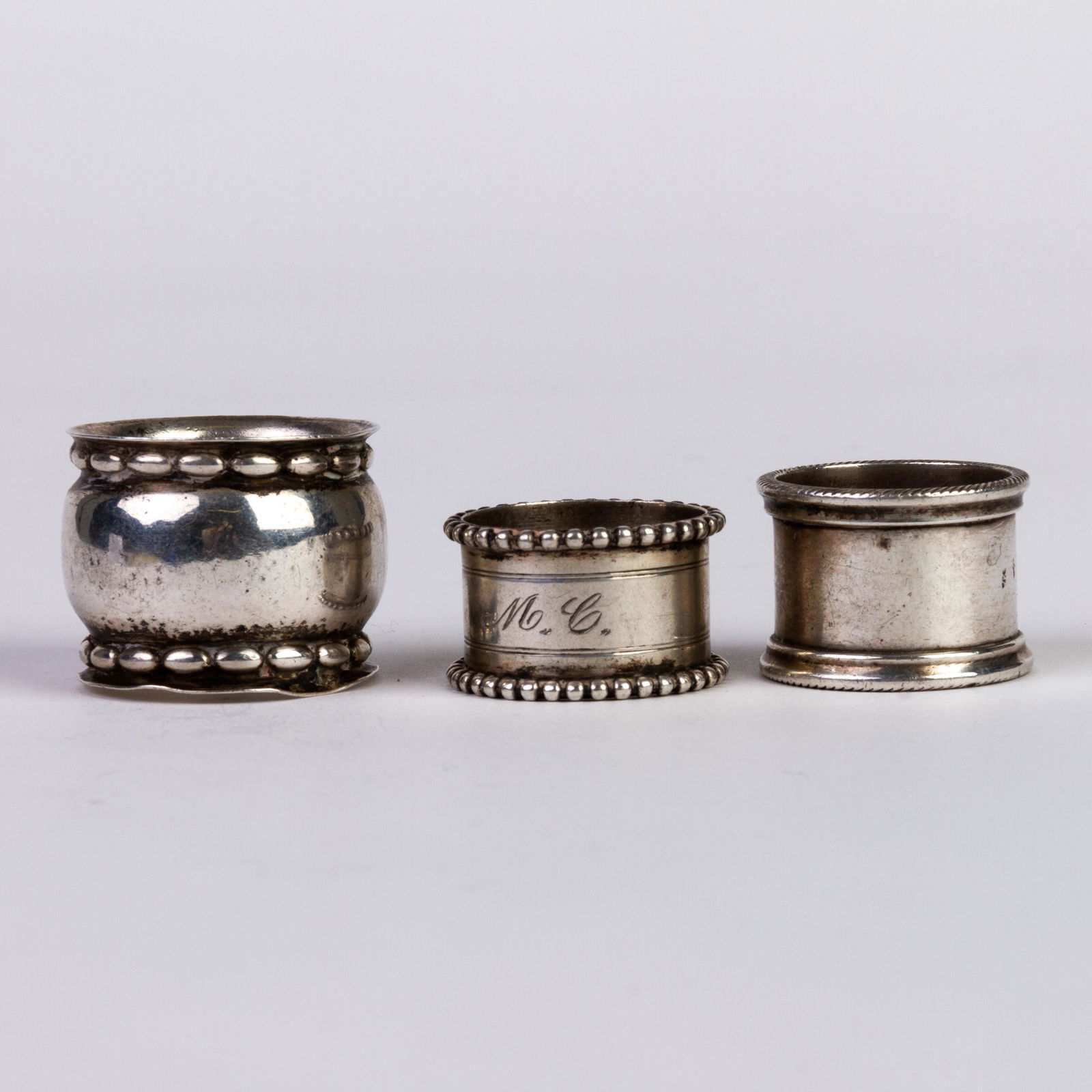 Three Sterling Silver Napkin Rings: DIMENSIONS APPROX 3x3x3CM. Please carefully study all photographs to get an accurate idea of the object. In good condition, as seen. Shipping is in-house and we ship internationally to US and rest of