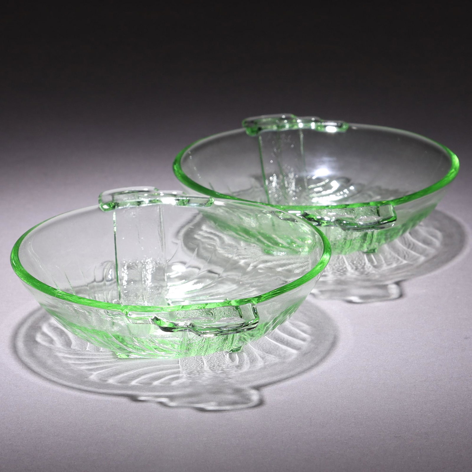 Uranium Glass Pair of Intaglio Art Deco Bowls: MEASURING APPROX 14.5 X 11CM. Please carefully study all photographs to get an accurate idea of the object. In good condition, as seen. Shipping is in-house and we ship internationally to US and rest 
