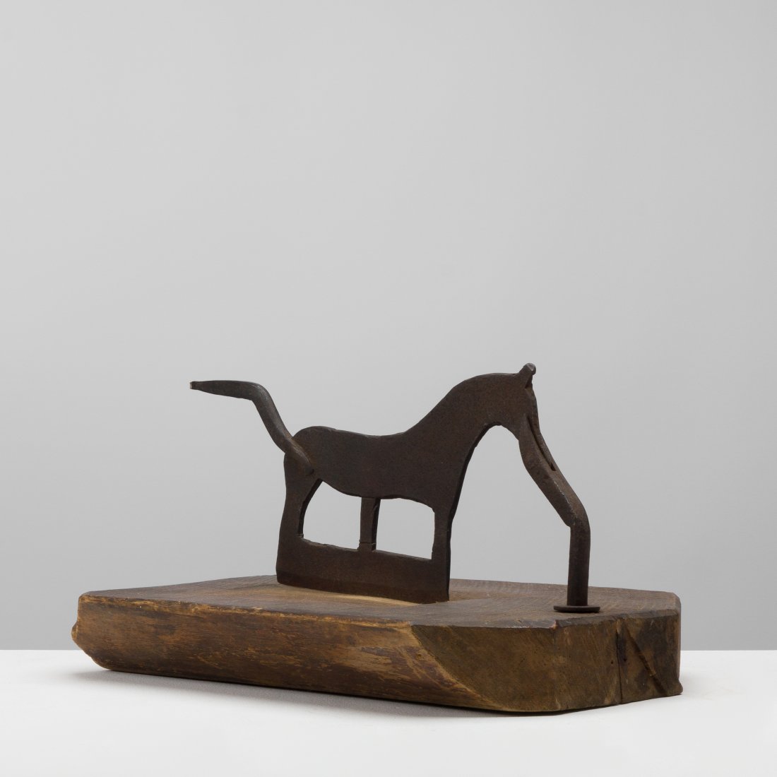 Folk Art, Tobacco Chopper: USA, 19th century steel, wood 7.25 x 11.75 x 10; 6 lbs Zoomorphic folk art tobacco chopper on wood slab. Provenance: Private collection, NYC