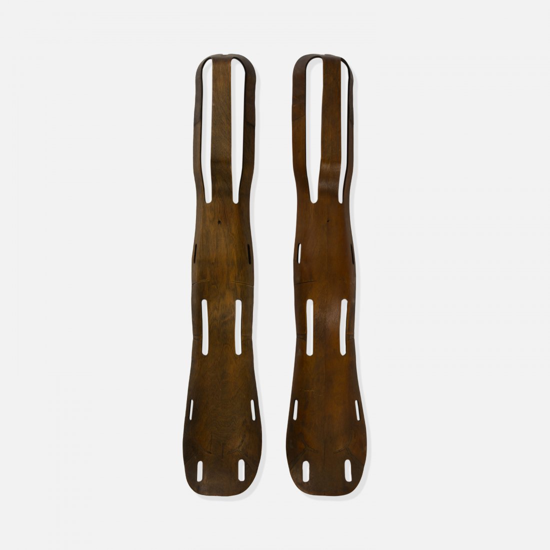 Charles and Ray Eames, Two Plywood Splints: USA, c. 1943 molded birch plywood 42" x 6" x 4" Two molded plywood splints by Charles and Ray Eames, produced by Evans Products. key: modern, mid century, modernist, brace, california