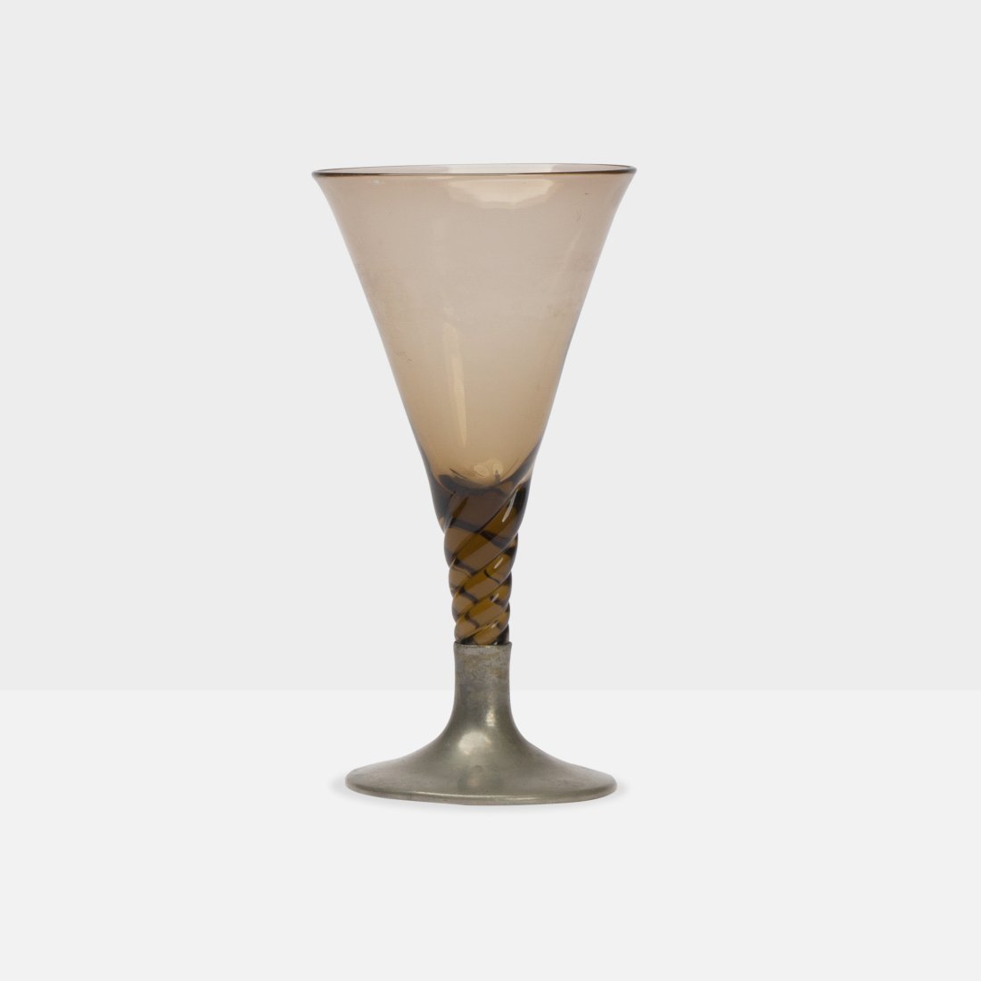 Rebecca Cauman, Wine Glass: USA, 1920s pewter, glass 8 7/8” x 4.5” diameter Uncommon wine glass by Rebecca Cauman with pewter base and twist stem. Marked [Cauman] to underside. Tags: modernist, mid century, arts and