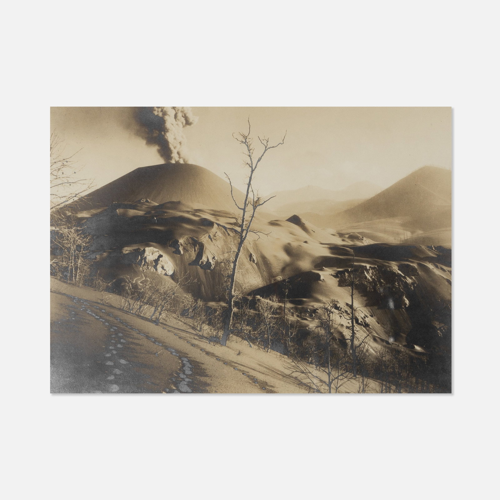 Hugo Brehme, Volcano and Ash, Paricutin: Mexico, 1944 19 7/8" x 15 1/8" frame 17 3/8" x 12 5/8" mount sepia-toned silver print Signed in pencil to recto. Works from this sale will be moved offsite to our ancillary location in Treadwell, NY a