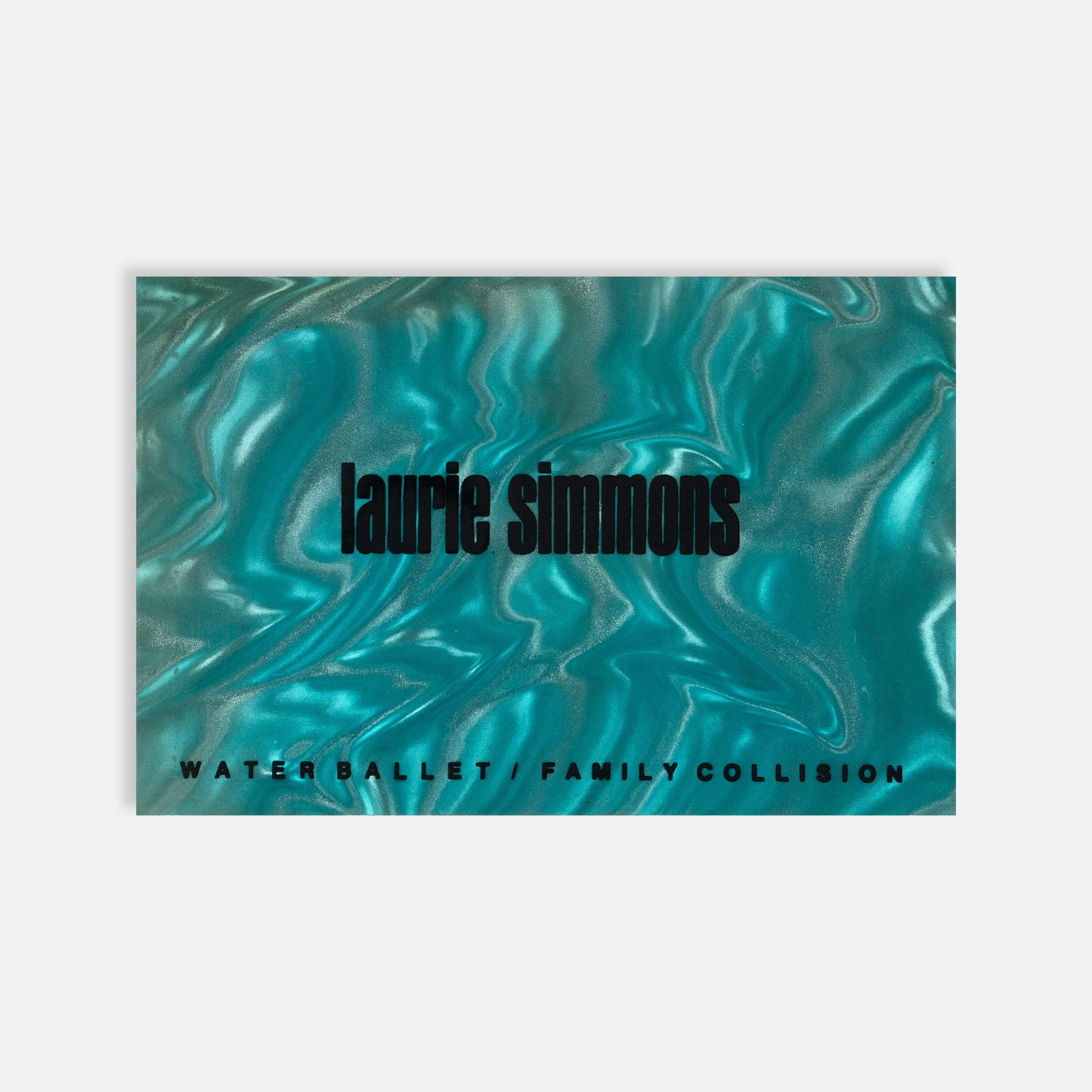 Laurie Simmons, Water Ballet/Family Collision: USA, 1987 9 1/8” x 6” offset printed First edition; Published by Walker Art Center; perfect-bound in textured boards. This item is located in our Treadwell, NY warehouse. Pickup and shippi