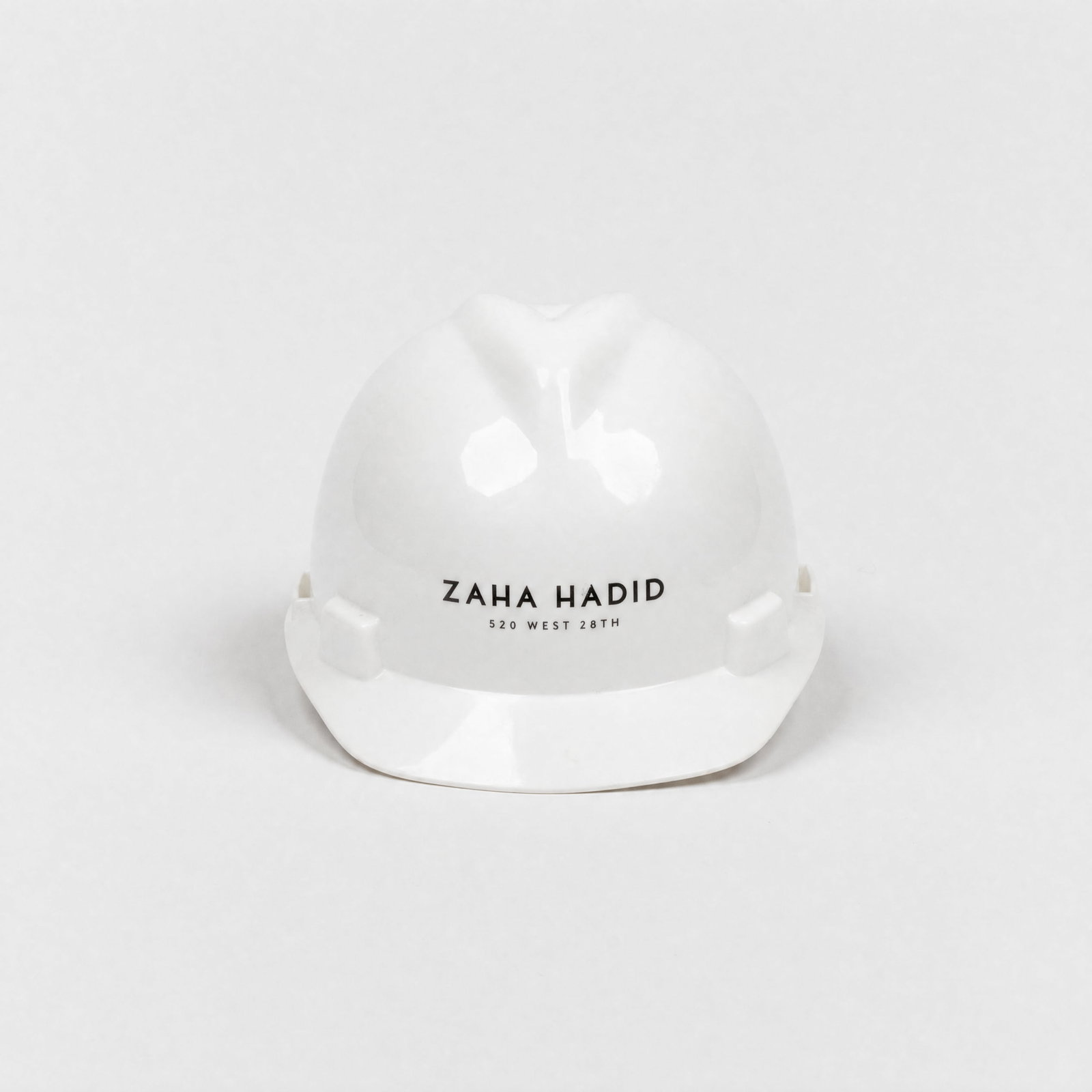 Zaha Hadid, Hard Hat: USA, c. 1990s 5 1/2" x 8 5/8" x 10 3/4" molded plastic Zaha Hadid (Iraqi-British, 1950–2016) was a, architect and designer whose practice redefined the landscape of 21st-century architecture. She pi