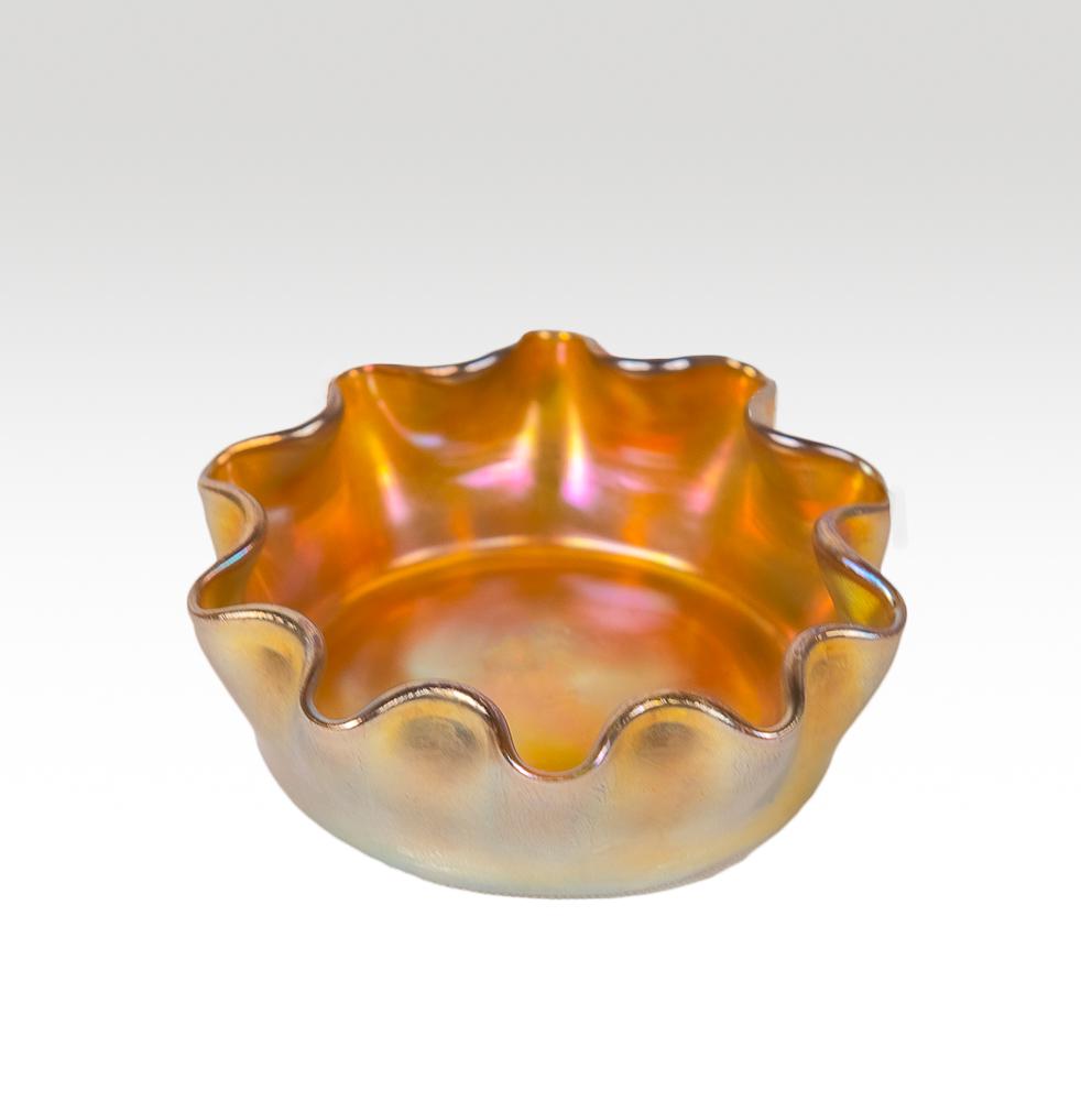 Louis Comfort Tiffany favrile salt cellar: marked l.c.t. Dimensions: 2 & 3/4" diameter Weight: 2 oz.