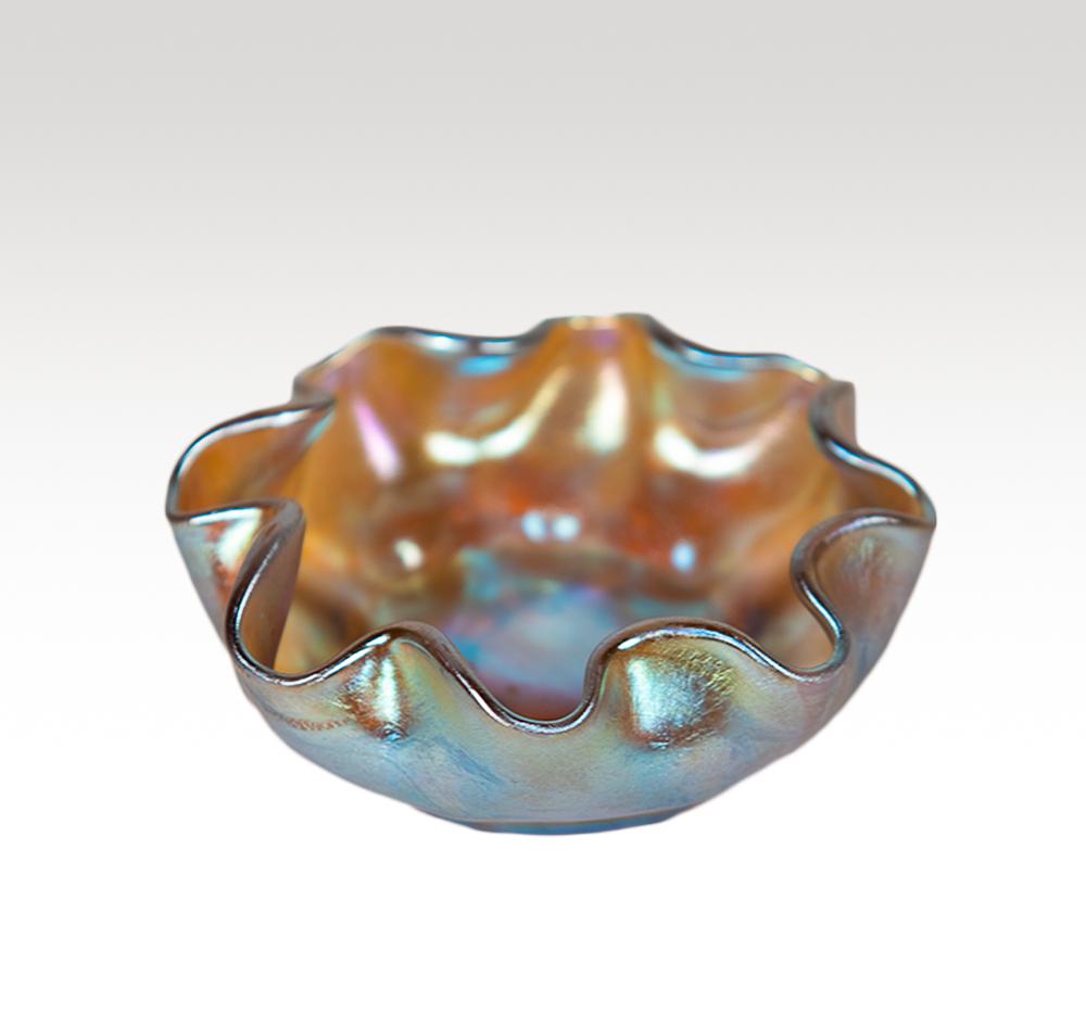 Louis Comfort Tiffany favrile salt cellar: With blue iridescence.Marked LCT Dimensions: 3" Weight: 2 oz.