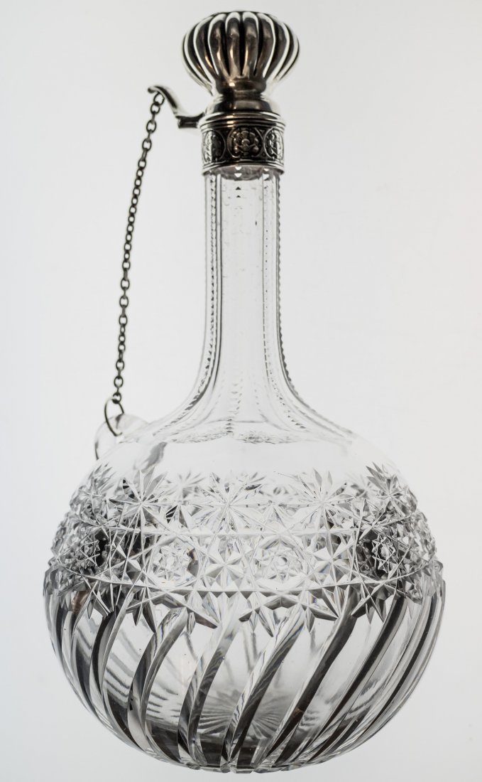 J. Hoare and Gorham Flip Top Cut Glass Decanter: This flip top, chain decanter was cut by J. Hoare in Persian and Swirl design with rayed star base. Top is marked Gorham.