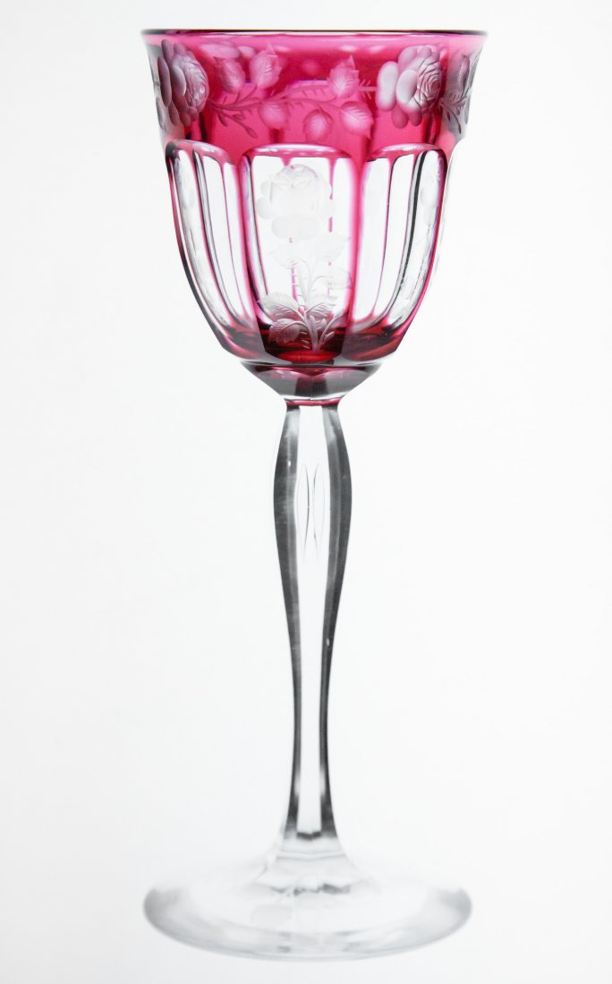 Incredible Steuben Cranberry Cut to Clear Hock Glass: Gorgeous cranberry to clear Steuben hock wine with great engraving throughout. Has an airtrap stem, fluted panels, and deep copper-wheel engraving.The base features three more sprigs.