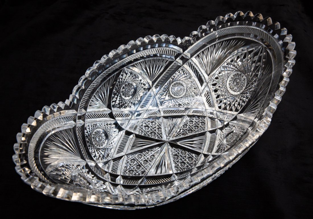 Giant Cradle Centerpiece Bowl American Brilliant Cut Glass Crystal: This is an unbelievably large, cradle-shaped centerpiece bowl. The quality of this piece is exceptional and features wood-wheel polishing. To my eye, this looks similar to a lot of Straus work, but I'