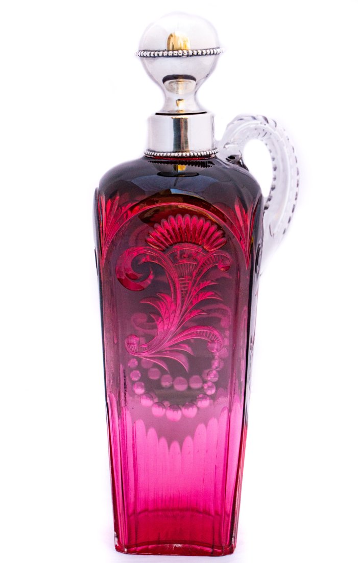 Gorgeous Stevens & Williams Green/Cranberry Brilliant Cut Glass Decanter w/ Silver: Fantastic example of two color Stevens & Williams with green to cranberry. Has the S&W style air trap handle and a great silver mount collar and stopper! Color combinations like this are become exceed