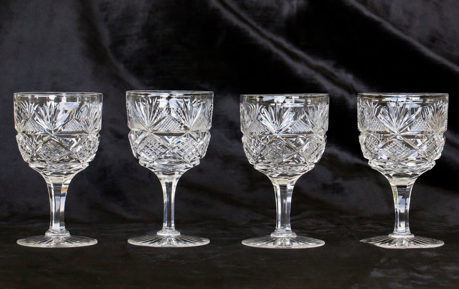 Beautiful Dorflinger Colonial American Brilliant Cut Glass Wine Stems: This auction is for 4 matching stems in Dorflinger's Colonial design. Wood wheel polishing. See previous lot for 4 more identical stems.