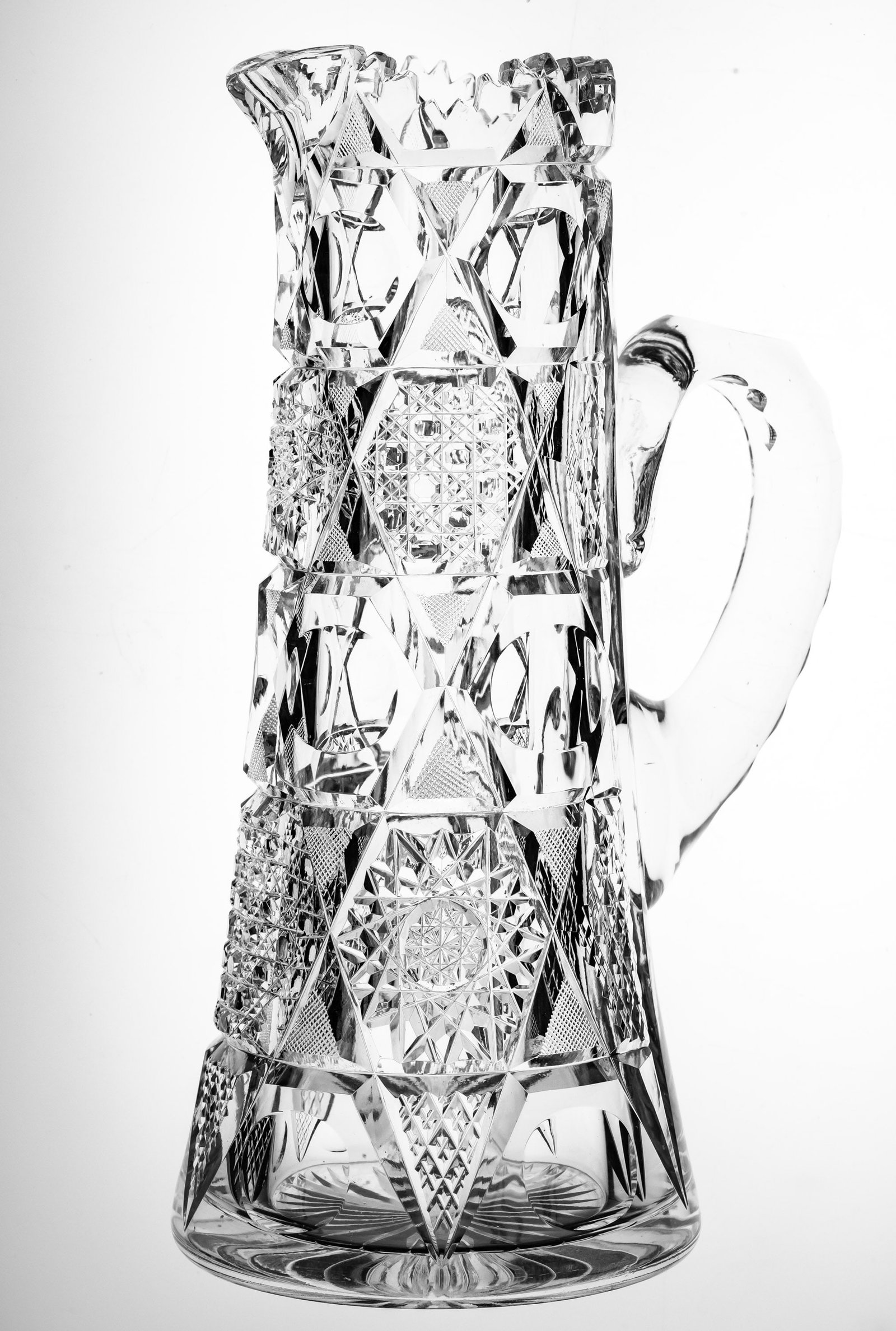 Heavy Shotton Phyllis Star of David American Brilliant Cut Glass Pitcher: Great, heavy pitcher featuring clear punties and overlapping stars of David. This pitcher was cut by Shotton in their Phyllis design. Great clear blank showing off the punties.