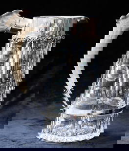 Spectacular Redlich Silver Mounted American Brilliant Cut Glass Pitcher w Antler Handle: This special pitcher was mounted by Redlich silver and has an antler horn for a handle. It is cut with vertical notching and punties - showing off the very clear blank. The base is covered with a 24