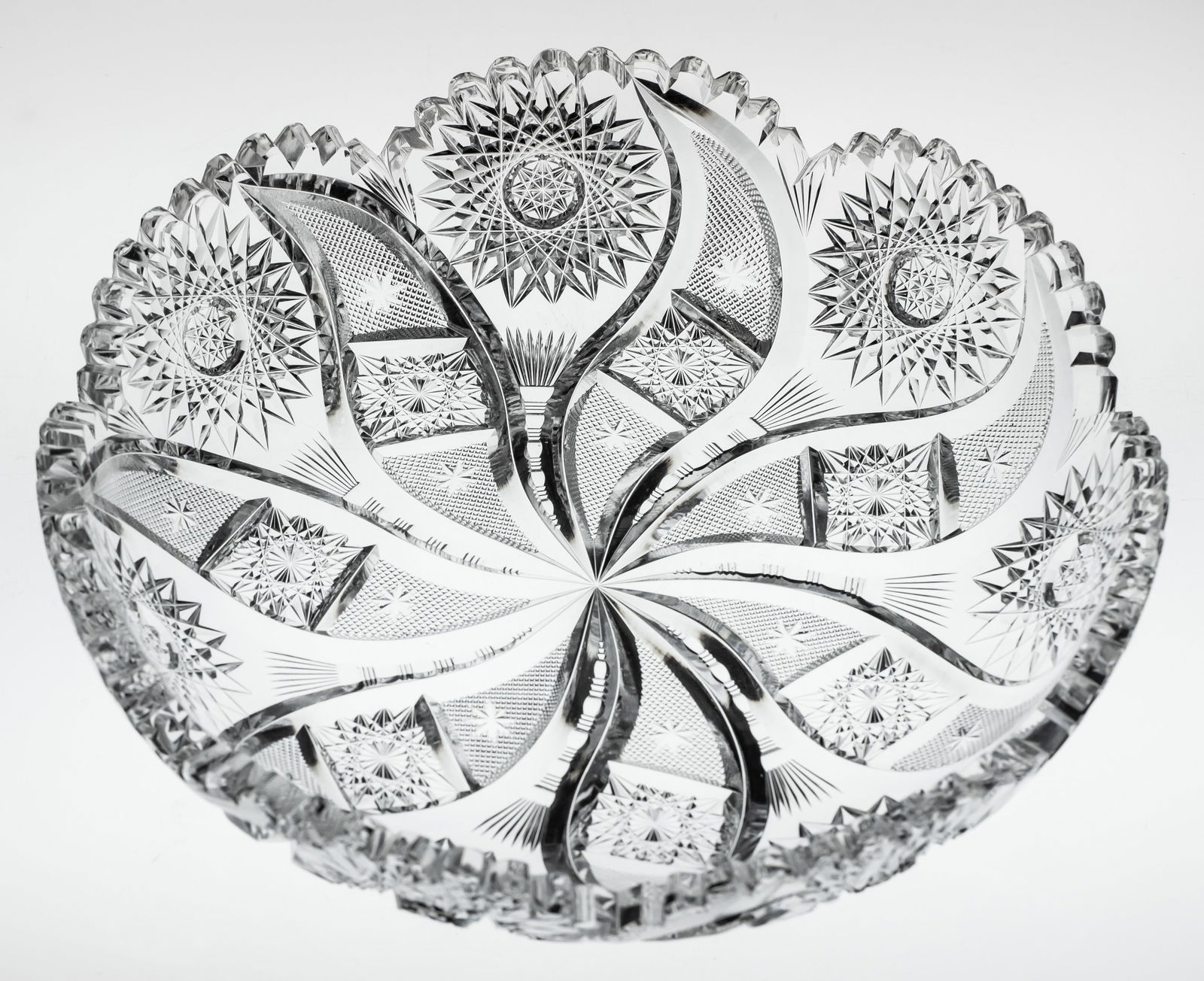 Nice C.F. Monroe Myrtice American Brilliant Period Cut Glass Low Bowl: This great swirling bowl was cut by C.F. Monroe in their Myrtice design. Myrtice is unusual in that it swirls in more than one direction. Most comet/swirling designs only swirl in one direction. Note