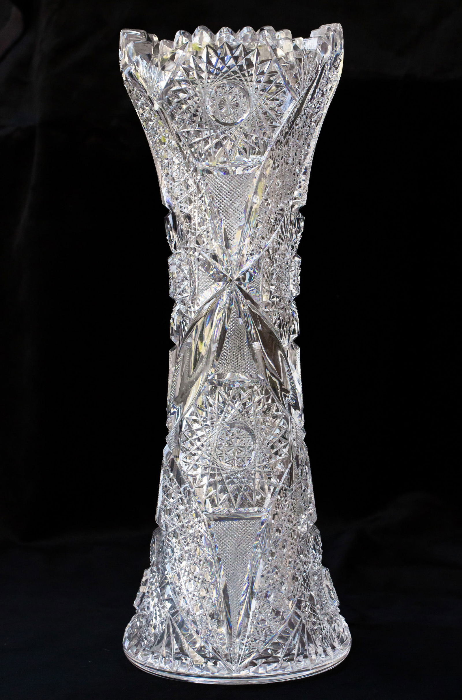 Massive Oconnor American Brilliant Cut Glass Corset Vase with Clear Tusks: This vase is cut on an extremely thick, clear blank in a design by Oconnor cut glass shown in their advertisements. The HUGE tusks are impressive to say the least - interspersed with hobstars, cane, a