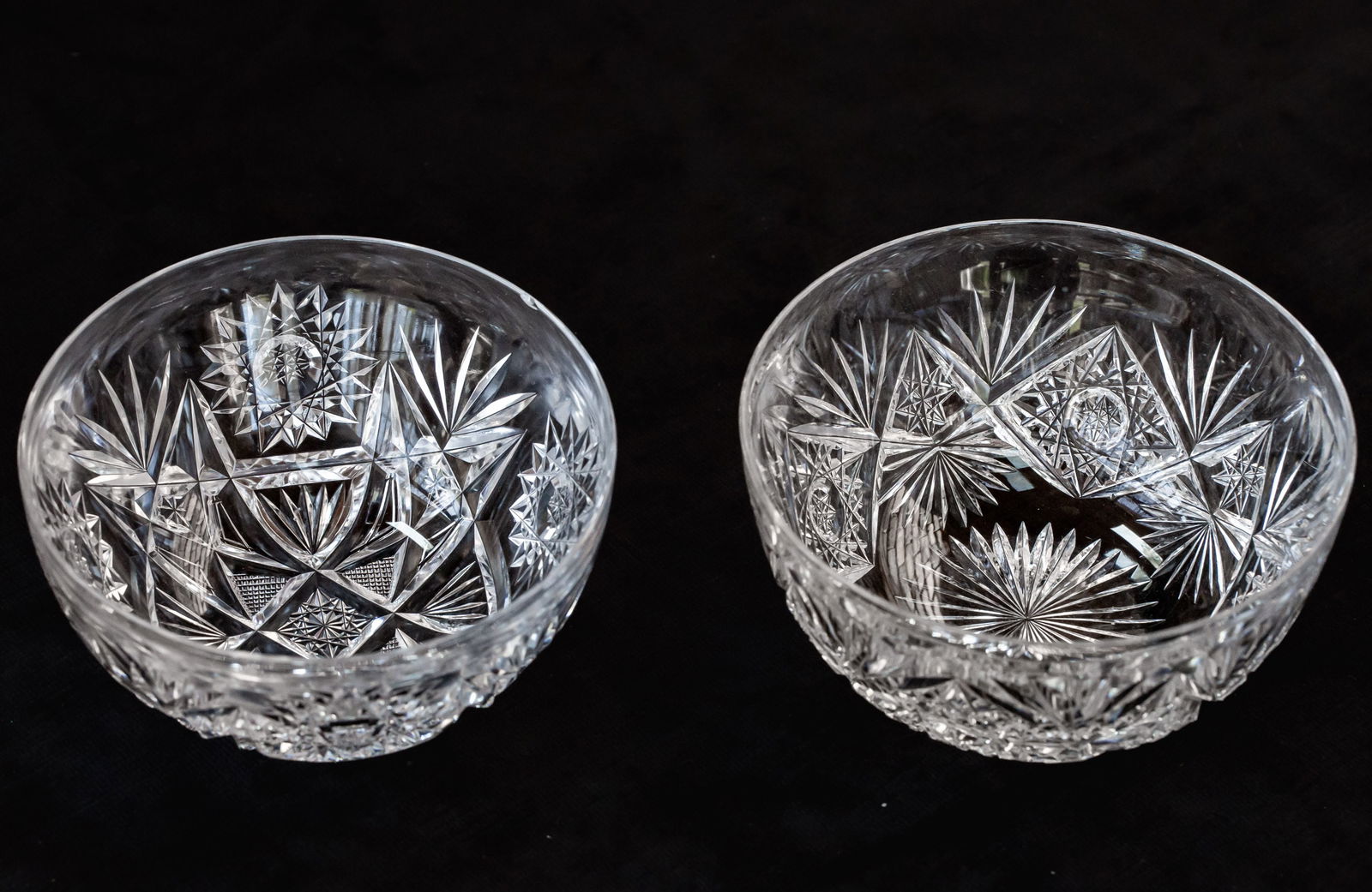 Two American Brilliant Period Cut Glass Finger Bowls: Finger bowl on the left has some Libbey elements to it. Also has a chip on the rim (shown).