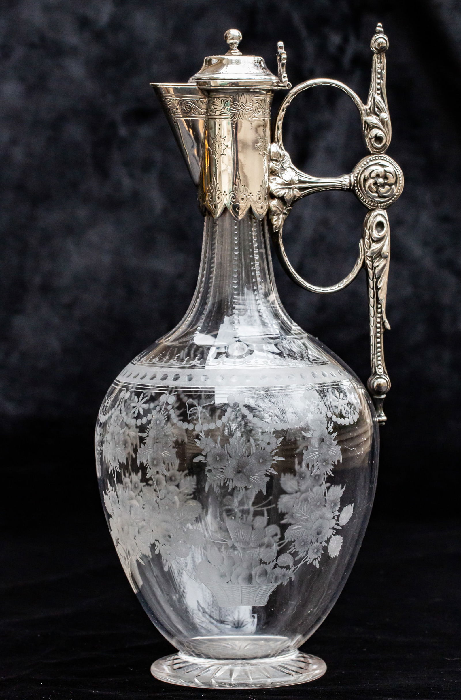 Fabulous Engraved Sterling Silver Brilliant Cut Glass Ewer Claret Jug: One of the most elegant ewers I've ever offered is this one with droaping flowers engraved throughout. Really neat details at the bottom of the engraving include a basket of fruit with a butterfly per