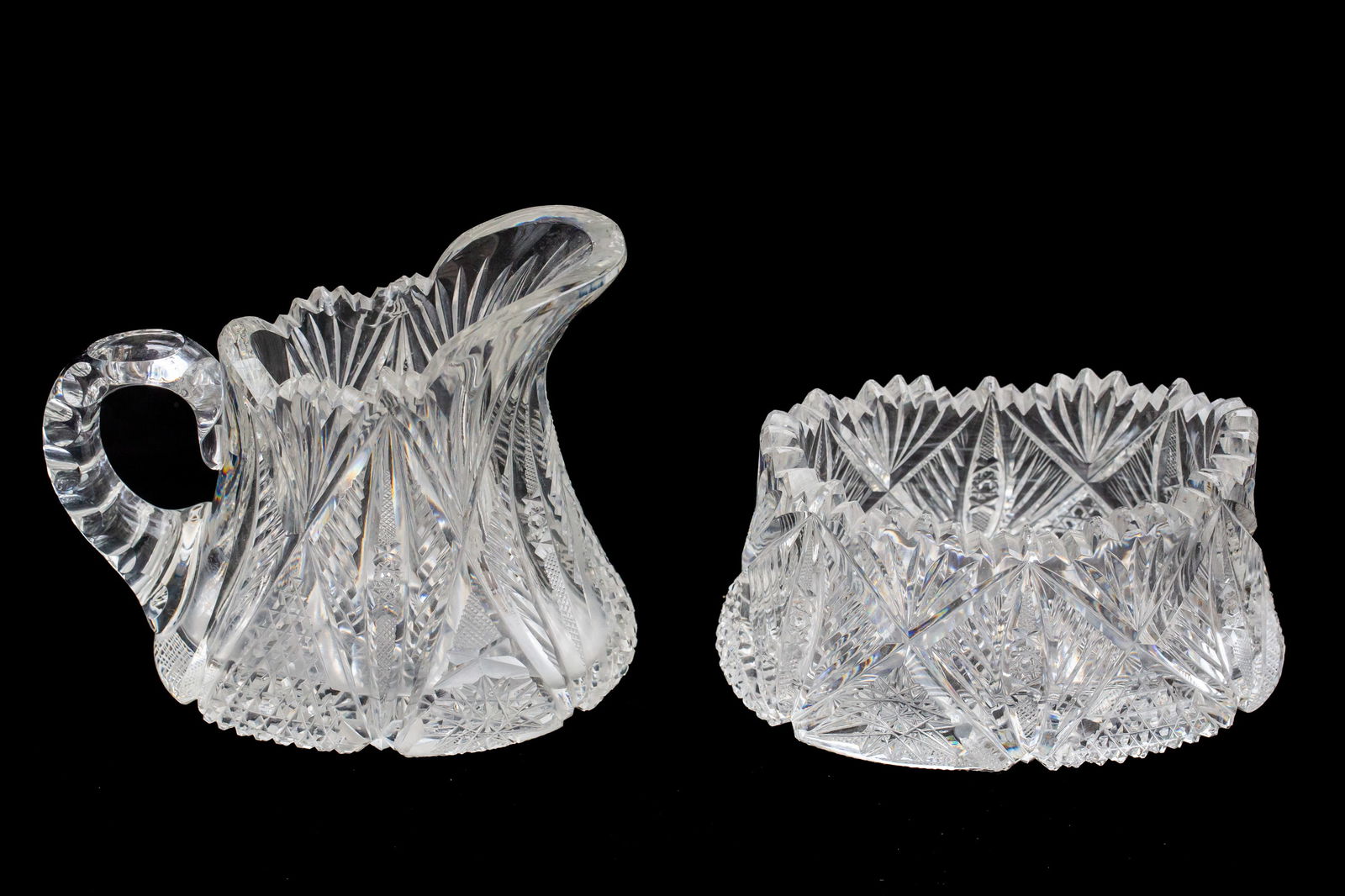 Extremely Unusual Dorflinger Brilliant American Brilliant Period Cut Glass Cream & Sugar: I've never seen this ovoid shaped blank cut by Dorflinger in their Brilliant pattern. Really heavy and well done - with full pattern across the base of both pieces. Unfortunately the creamer has a che