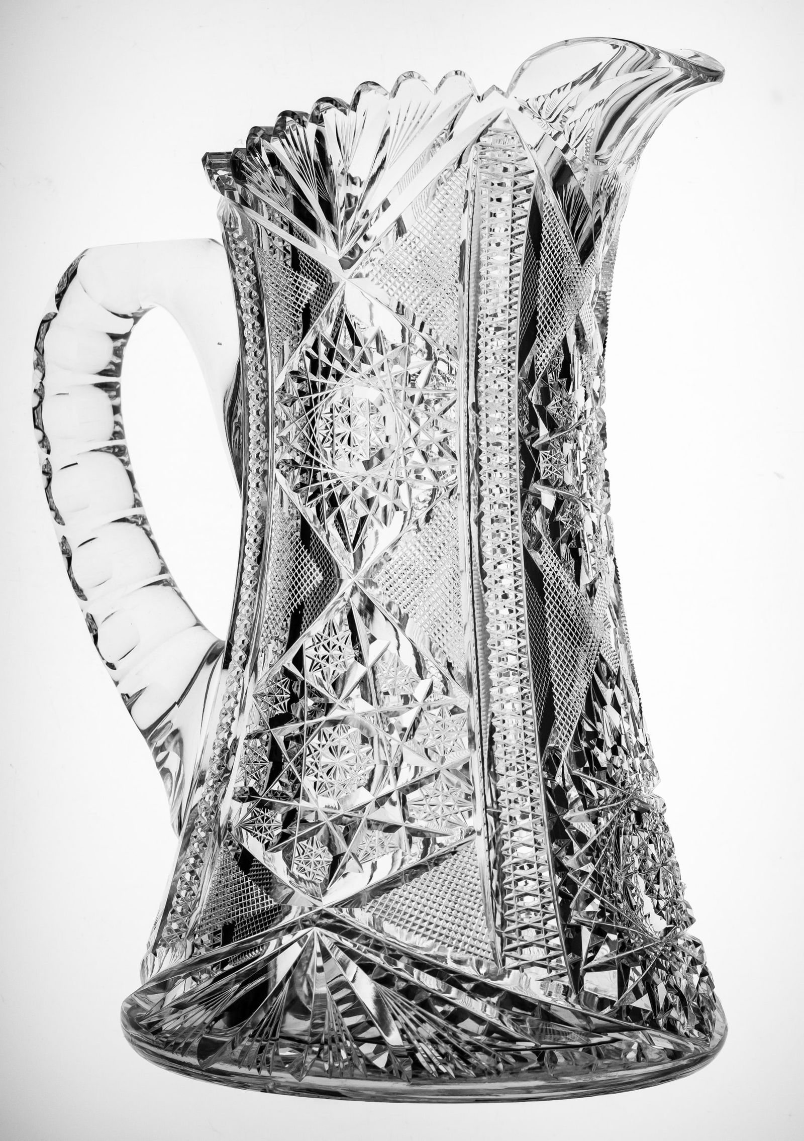 Heavy Blackmer Columbia American Brilliant Period Cut Glass Pitcher: Nice heavy piece cut by Blackmer in their Columbia design. This is the nicer rendition of the pattern with the hobstar cluster on both sides and the front of the pitcher and a large hobstar base. Grea