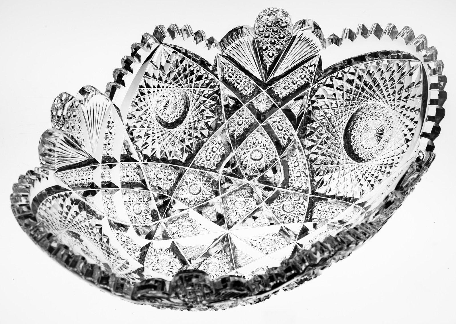 Classic Shotton Spencer American Brilliant Cut Glass Orange Bowl: This orange bowl was cut in Shotton's popular spencer design. It features deeply cut hobstars intertwined with ribbons of can cutting. The most identifiable and unique portion of the design is at the