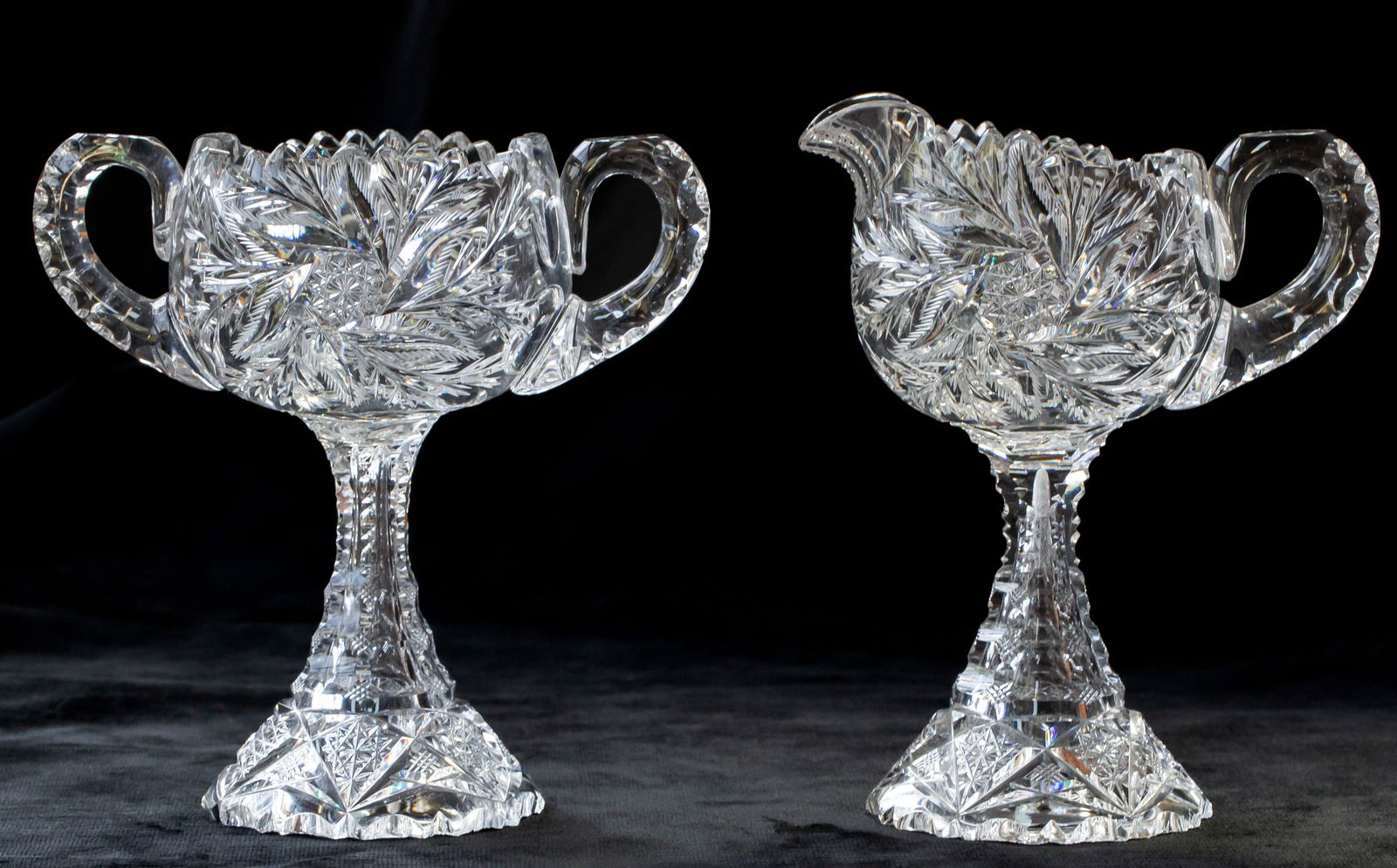 Unusual William C. Anderson Fern American Brilliant Cut Glass Cream and Sugar: This cream and sugar is an extremely rare form from William C. Anderson in American Cut Glass Co's Fern design. Both pieces stand tall on a petticoat base that is covered in Anderson motifs. Unfortuna