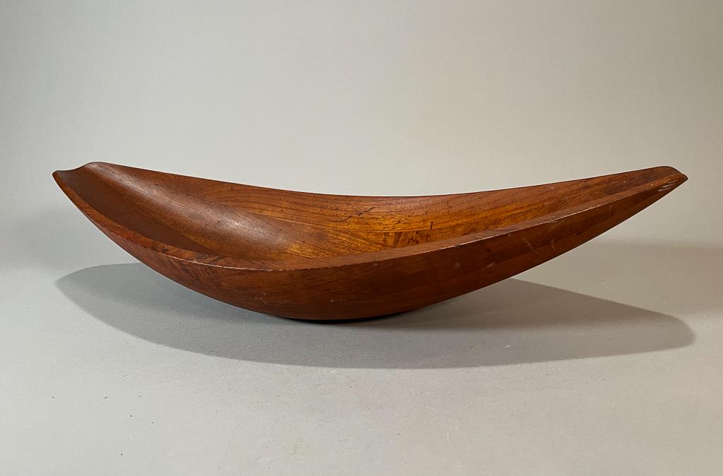 Mid Century Canoe Bowl by Jens Quistgaard for Dansk: Large Dansk staved teak 'canoe' bowl by Jens Quistgaard 1950s; staved teak bowl in a broad tapered form designed by Jens Quistgaard for Dansk; made in Denmark; 5 1/4" x 24" x 11 1/4" (approx.)