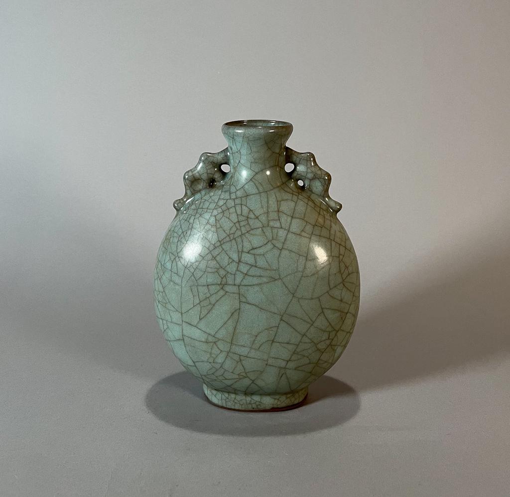 Chinese Crackle Glazed Celadon Porcelain Moon Flask: Chinese crackle glazed celadon porcelain moon flask; 8 1/2" x 6 1/4" x 3 1/2" (approx.)