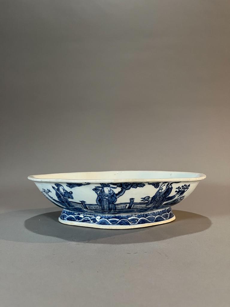Chinese Blue & White Porcelain Brush Washer: Chinese blue & white porcelain footed brush washer; of oblong petal-mouth form, with bats to interior, scholars in a landscape to exterior; six-character mark to base; 2 1/2" x 10 1/2" x 8" (approx.)