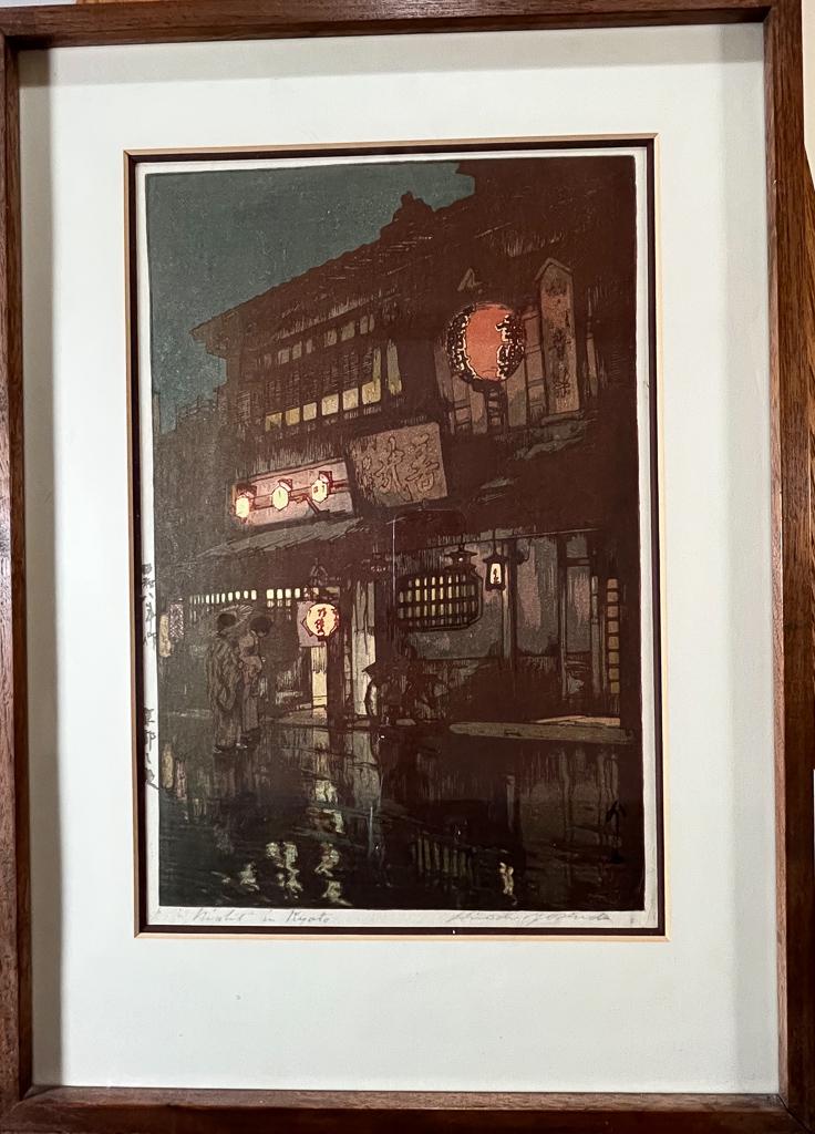 Hiroshi Yoshida "Night in Kyoto" Woodblock Print: Woodblock print by Hiroshi Yoshida (Japanese 1876-1950); "Night in Kyoto" from the Kansai District series; depicting two figures outside of a lantern-lit shop at night; titled lower left, signature lo