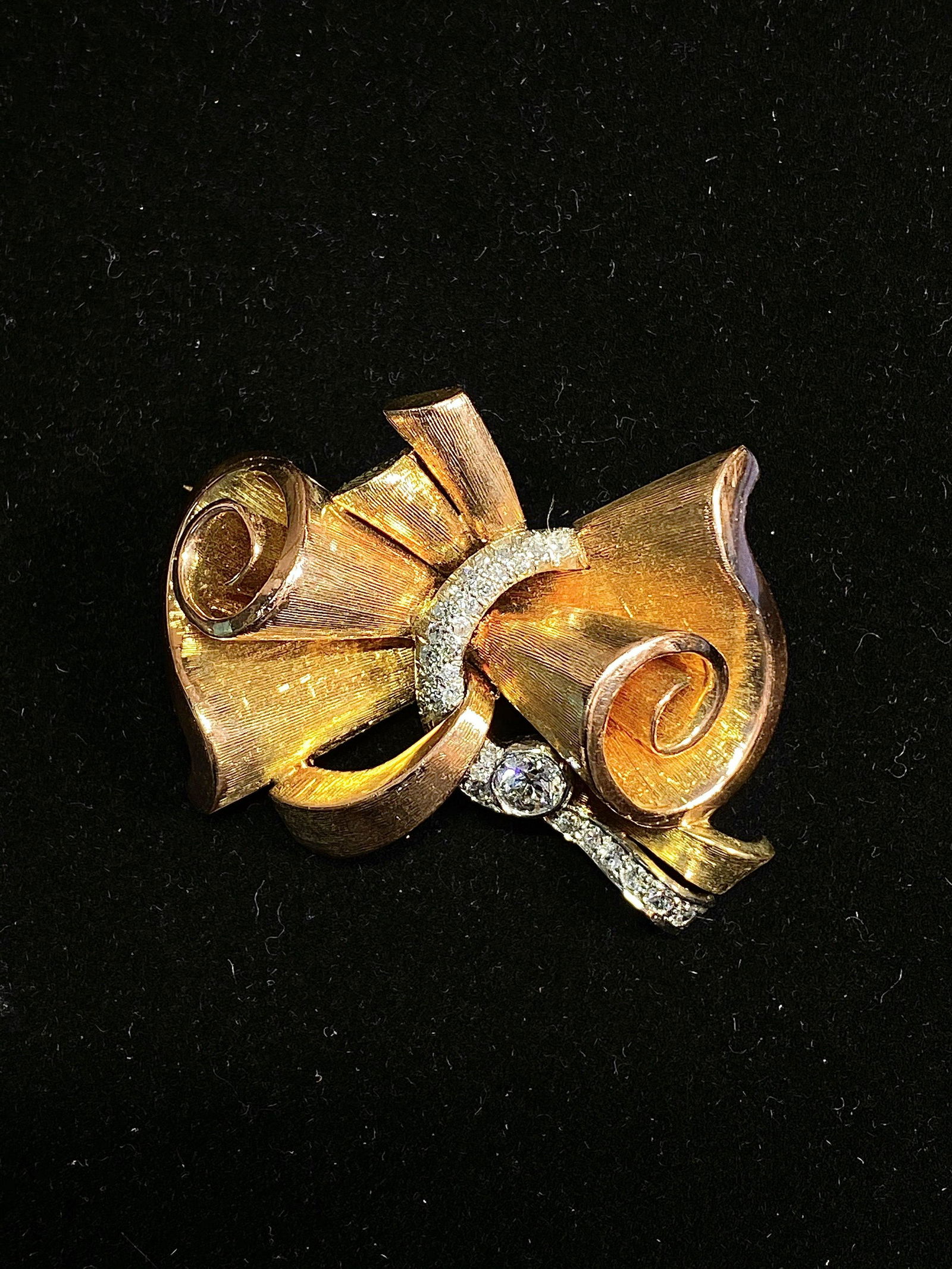 1940s Vintage White/Yellow Gold Fluted 30 Diamonds Bow Brooch/Pin w $25K Certificate of Authenticity: 1930S VINTAGE FLUTED DIAMOND BOW BROOCH IN 14K YELLOW & WHITE GOLD - $25K VALUEITEM DESCRIPTION This 1930s Vintage Fluted Diamond Bow Brooch in 14K Yellow & White Gold features (31) pave-set diamonds