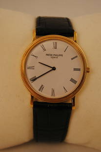 Patek Philippe Ultra-Thin Calatrava Men's Wristwatch in 18K Yellow Gold - $40K VALUE: This Patek Philippe Calatrava Men's Wristwatch has an Ultra-Thin Case with a Water Proof Screw Back. This watch features an 18K Solid Yellow Gold Case Hobnail Bezel crown lugs and back. The timepiece