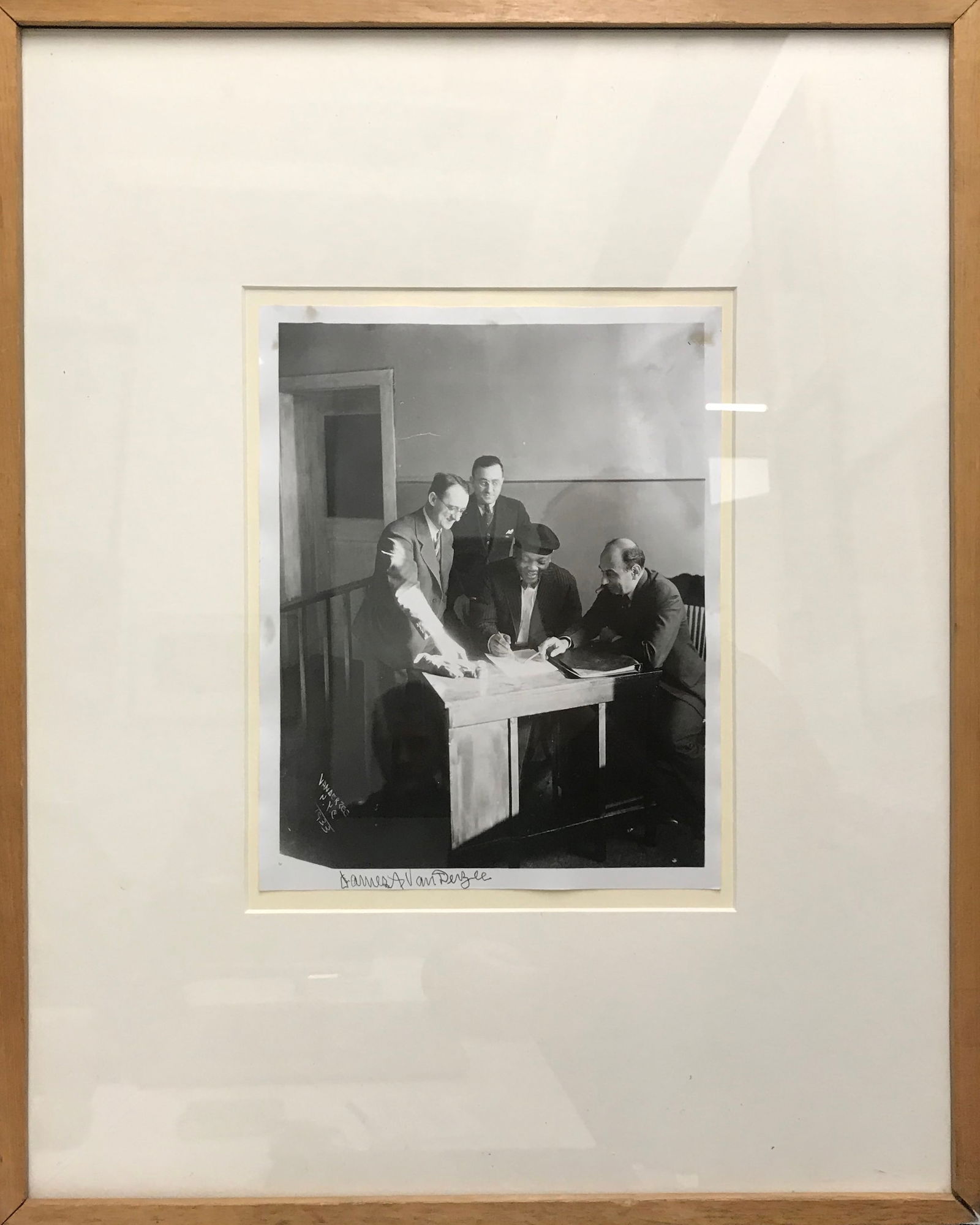 JAMES VAN DER ZEE Autographed Photograph of Heavyweight Boxer Jack J.-$30k w COA: This rare piece of history captures world champion boxer Jack Johnson signing documents in a photo taken by famed photographer James Van Der Zee. African American photographer Van Der Zee (1986-1983)