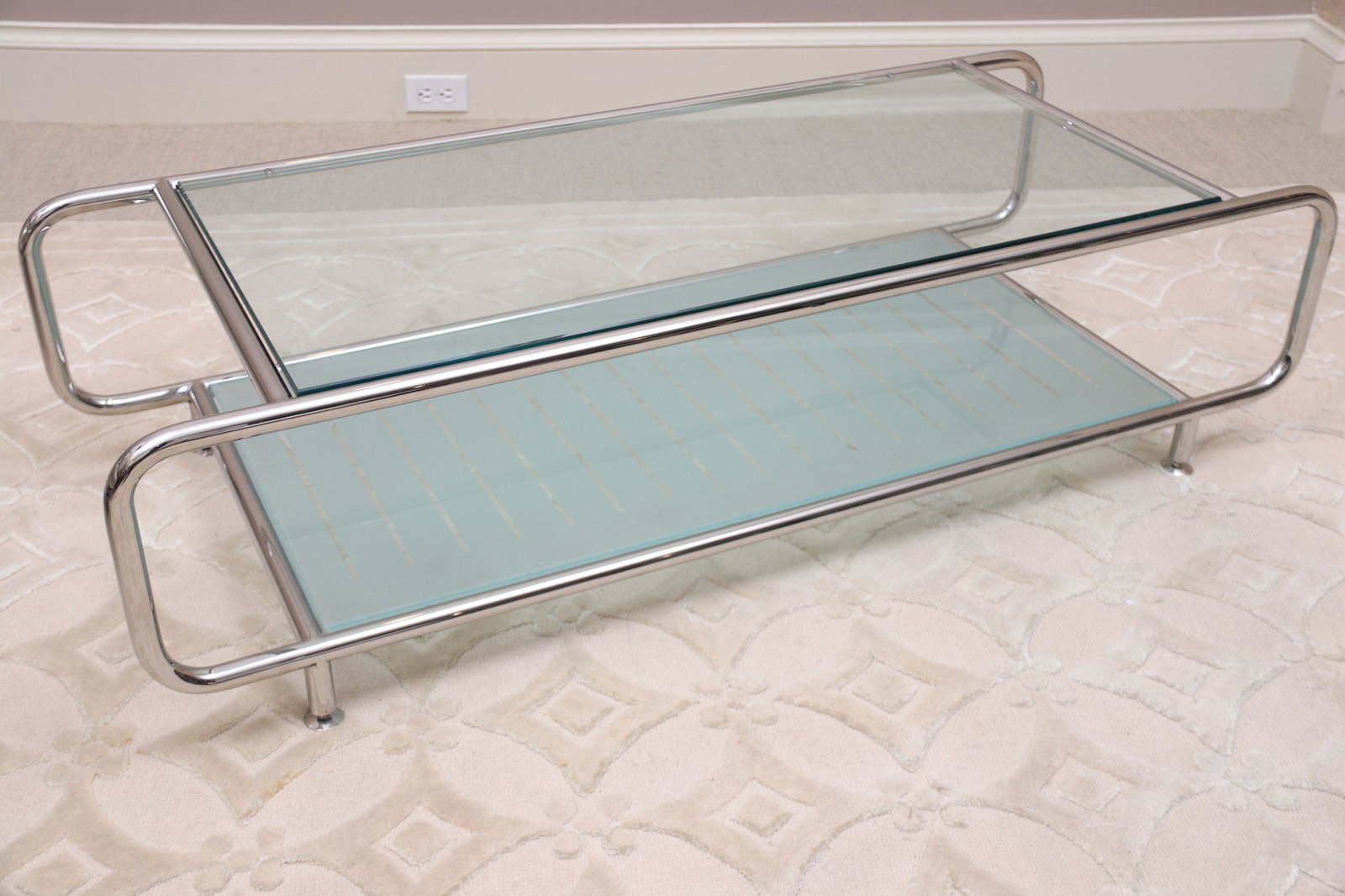 Brueton Bridget Glass And Chrome Low Two-Tier Coffee Table Very Rare: 'BRIDGET' LOW RECTANGULAR TWO-TIER COFFEE TABLE BY STANLEY JAY FRIEDMAN FOR BRUETONThe 'Bridget' table's design is a melange of twentieth and twenty-first century design. Designer Stanley Jay Friedman