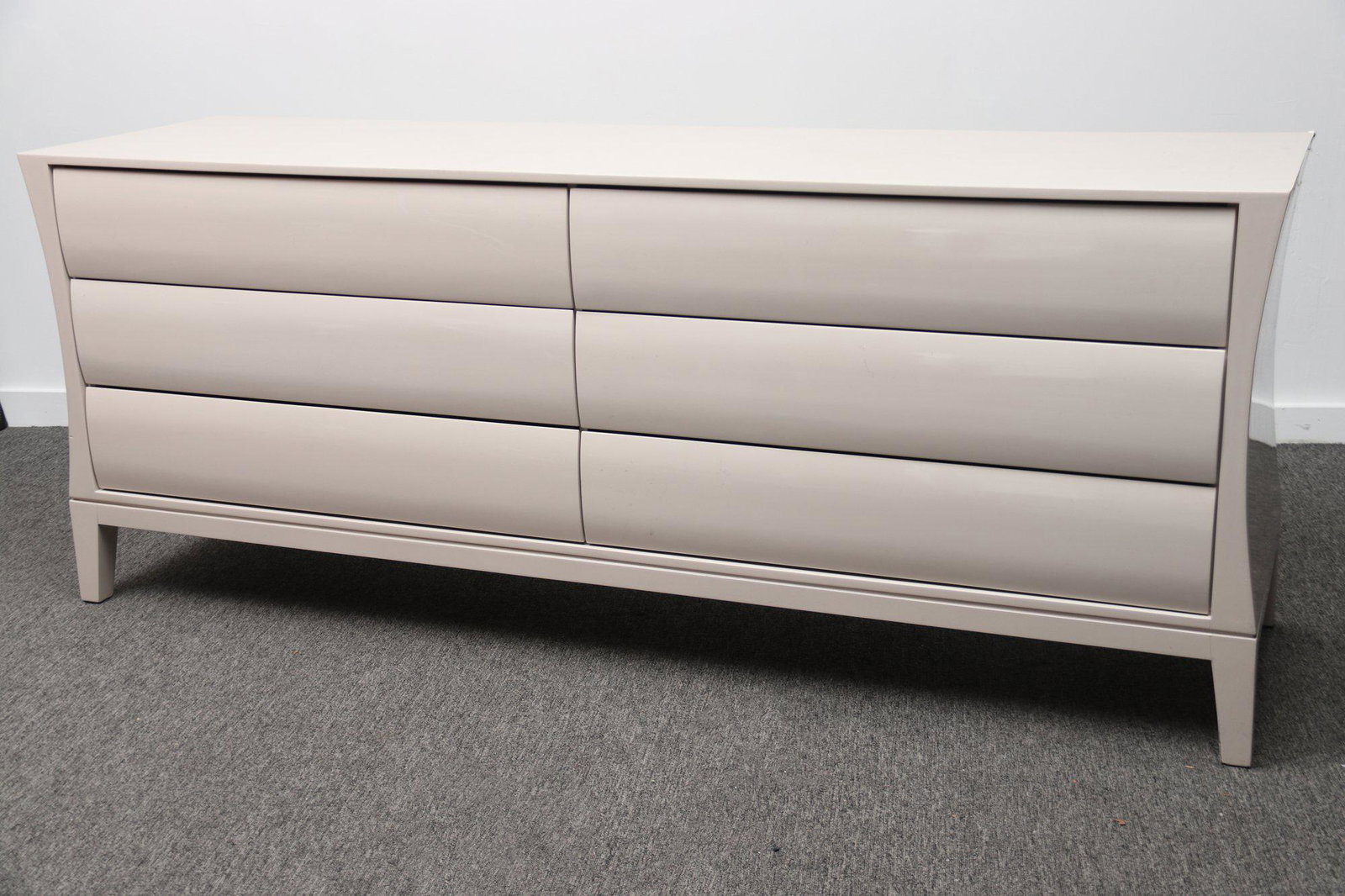 Custom Italian Lacquer 6 Drawer Dresser: Make waves with this custom lacquer dresser. The ivory color gloss finish angular shape and wave drawer-front design put this 6-drawer dresser squarely in the contemporary or Asian Zen design styles.N