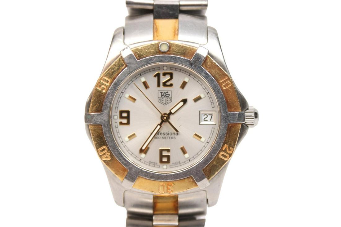 TAG Heuer Link Professional 18K & Stainless Steel Men's Watch: Tag Heuer Professional wristwatch reference number W1153 featuring a stainless steel case a 18K gold unidirectional rotating bezel and a silver dial with gold arabic and stick markers. It has a Swiss