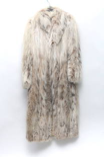 Christian Dior Russian Lynx Belly Fur Coat Size 12: Calf-length Christian Dior lynx fur with wide lapel two exterior pockets one interior pocket with zipper closure label reads Christian Dior New York-53 long-24 arms-65 sweep