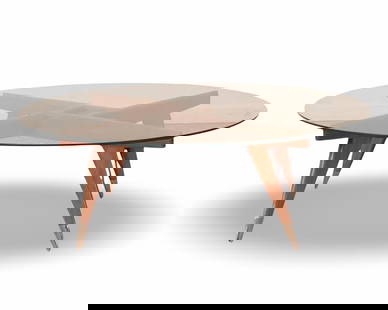 Mid Century Coffee Table Attributed To Gio Ponti: Wood and glass coffee table in the manner of Gio Ponti. Light typical wear to glass. Brass capped feet