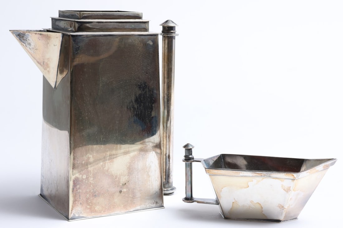 Louis W Rice Skyscraper Water Pitcher And Creamer: Silver-plated Skyscraper Two-piece set includes water pitcher and creamer Apollo Studios line circa 1928 manufactured by Bernard Rices Sons Inc. Rectangular with cylindrical handle impressed 5258 and