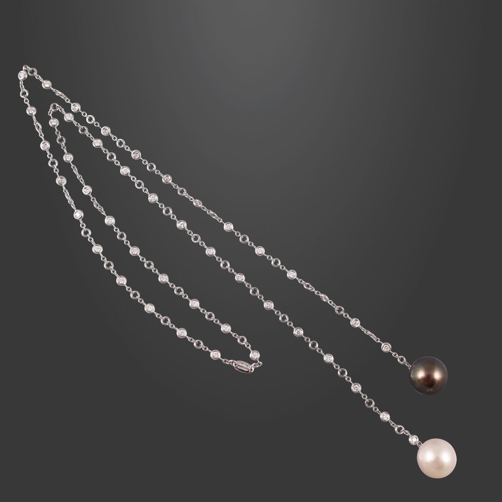 18KT GOLD SAUTOIR WITH DIAMONDS AND CULTURED PEARLS, BY CRIVELLI: Total weight gr. 18,4 Total diamonds weight approx. 2,20 ct Pearls diameter approx. 13,8 mm Length approx. 67 cm