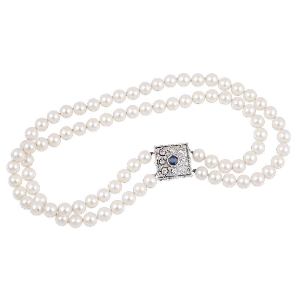 A SINGLE STRAND OF CULTURED PEARLS WITH 18KT GOLD CLASP SET WITH SAPPHIRE AND DIAMONDS, BY (1 of 1)