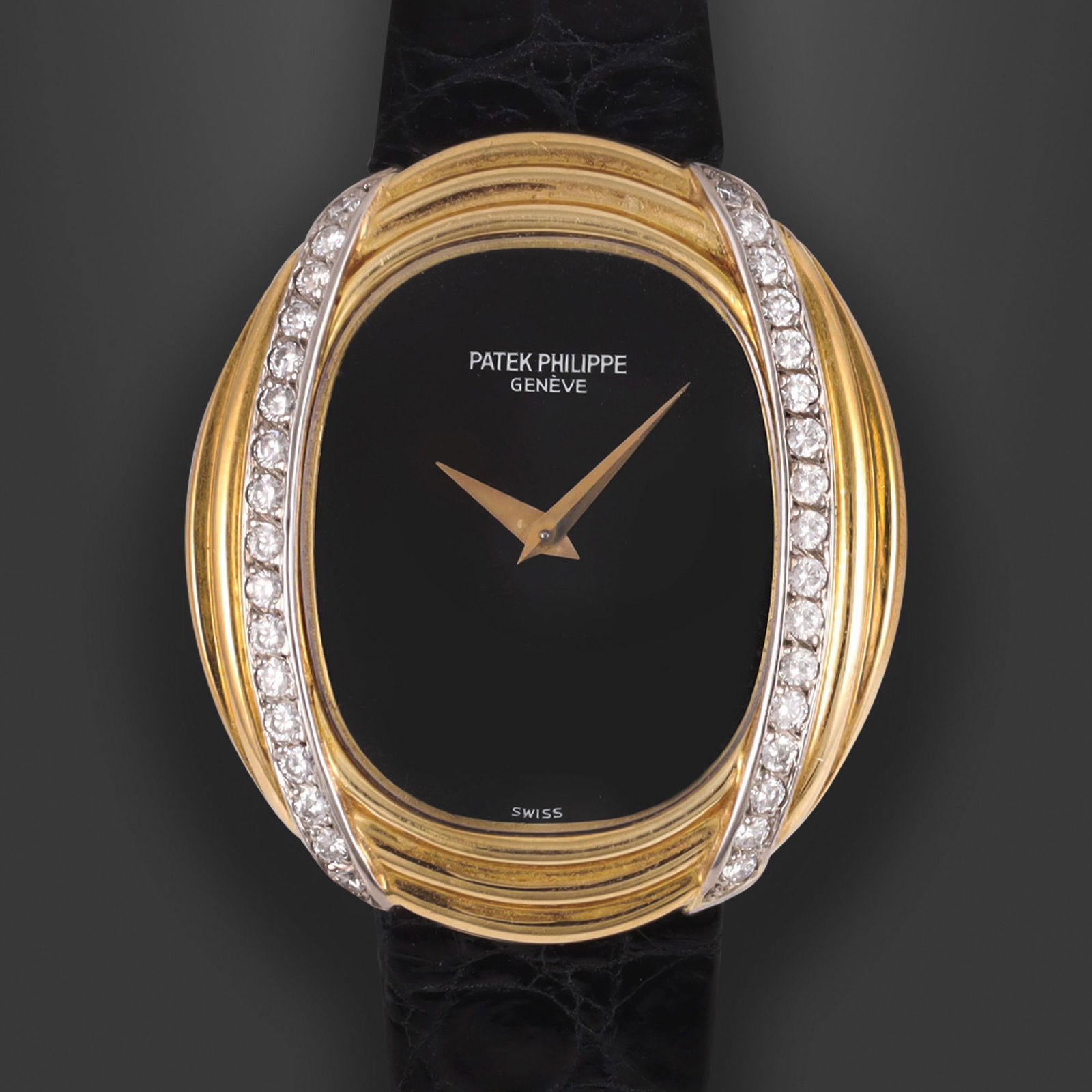 PATEK PHILIPPE: PATEK PHILIPPE Ref: 4288, 'Golden Ellipse' Fine and rare, 18K yellow gold and diamonds oval wristwatch with onyx dial and gold original buckle Made circa 1980. Accompanied by the original box