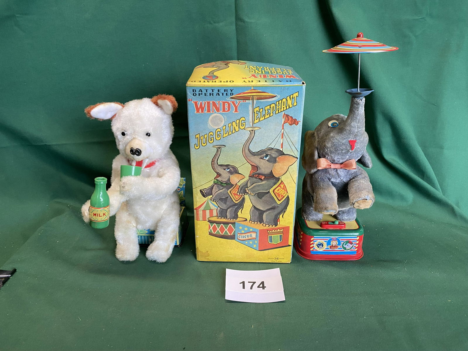 2 Japanese Battery Operated Toys: Windy Juggling Elephant. Old store stock unused in box by TN. Milk drinking bear. Good conditions. Paint lost on battery door (not corrosion). TNS. Shipping is available.