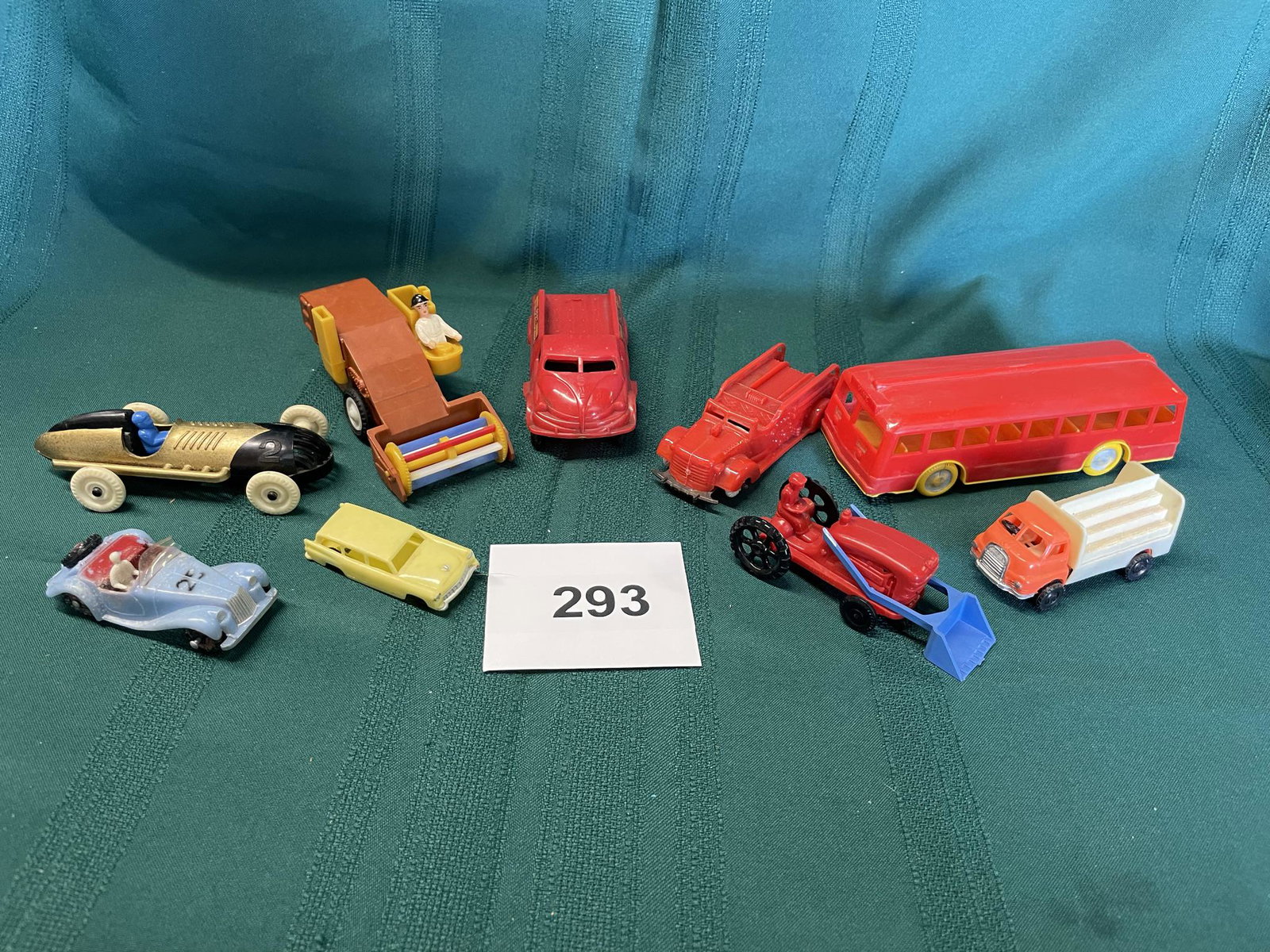 Selection of toy vehicles: Bus, Race Car, Farm thrashing machine, Lionel station wagon, Tractor, Morgan Sports Car, Shipping is available.