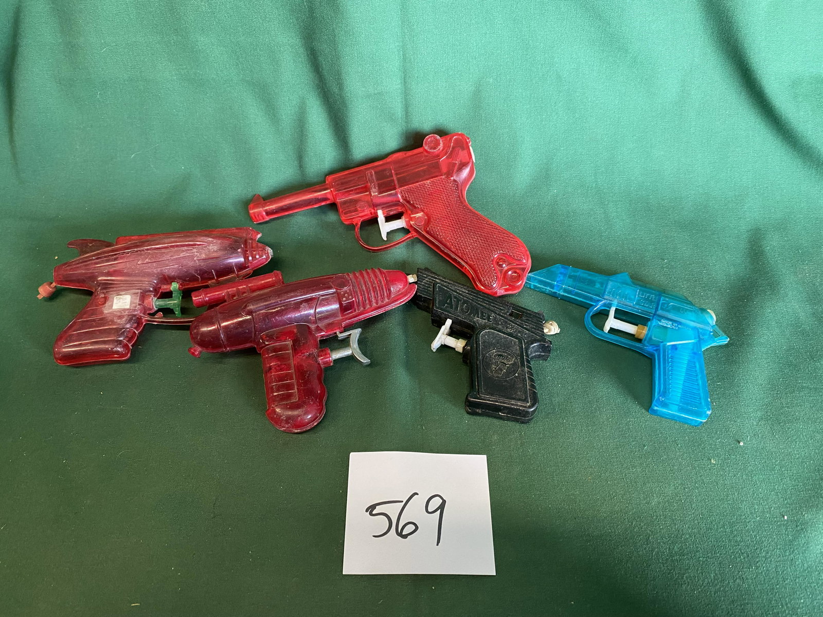 1960's water pistols: 3 pistols and 2 space gun shaped. Shipping is available.