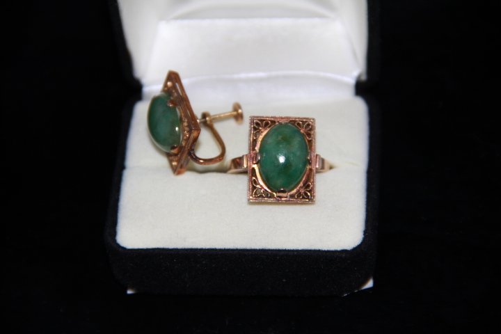 1 - Jade Earring and 1 - Jade Ring: Design of Earring and the ring match - they are a matching set. Appears that someone converted an earring into a ring. Earring has clip back. No gold marks of any kind on jewelry. Design and workmansh